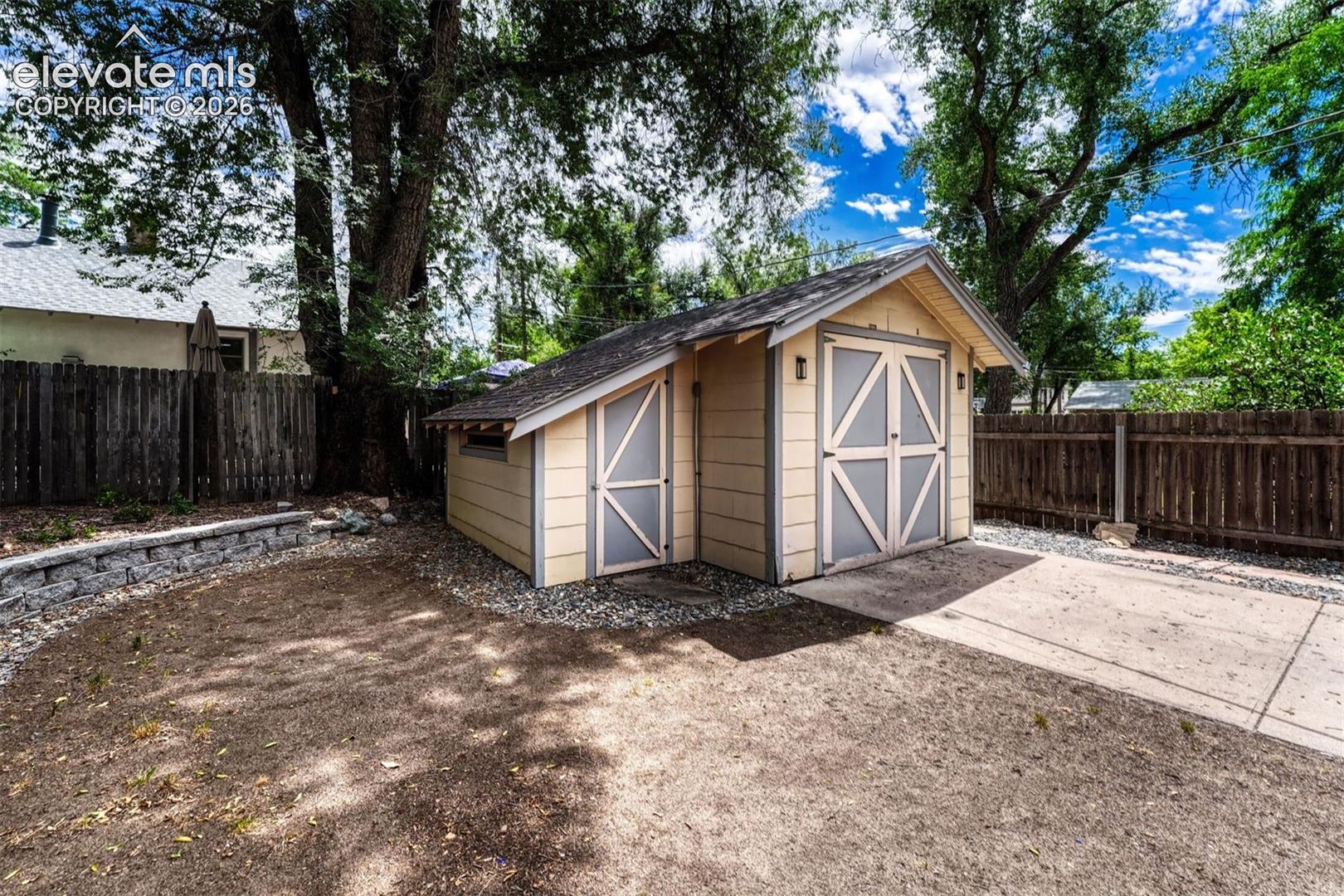 Storage shed and adjoining 1 car garage or workshop