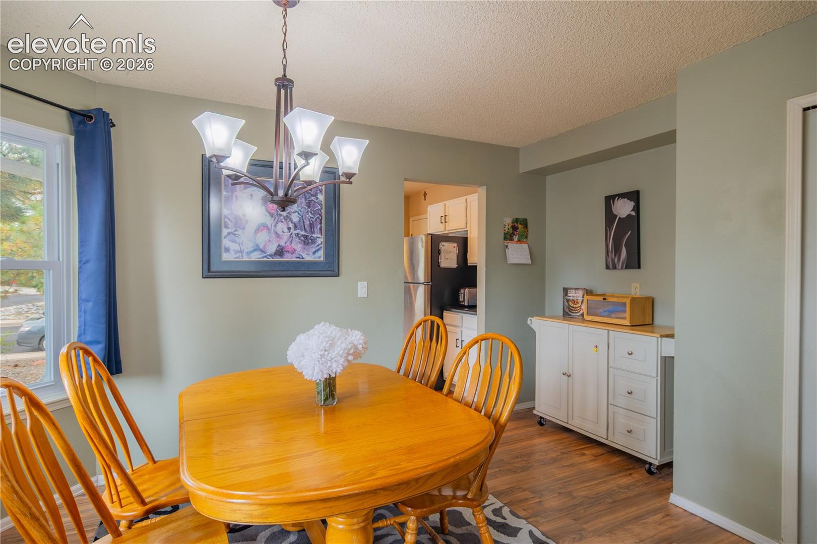Wood-finish flooring with light green wall tones