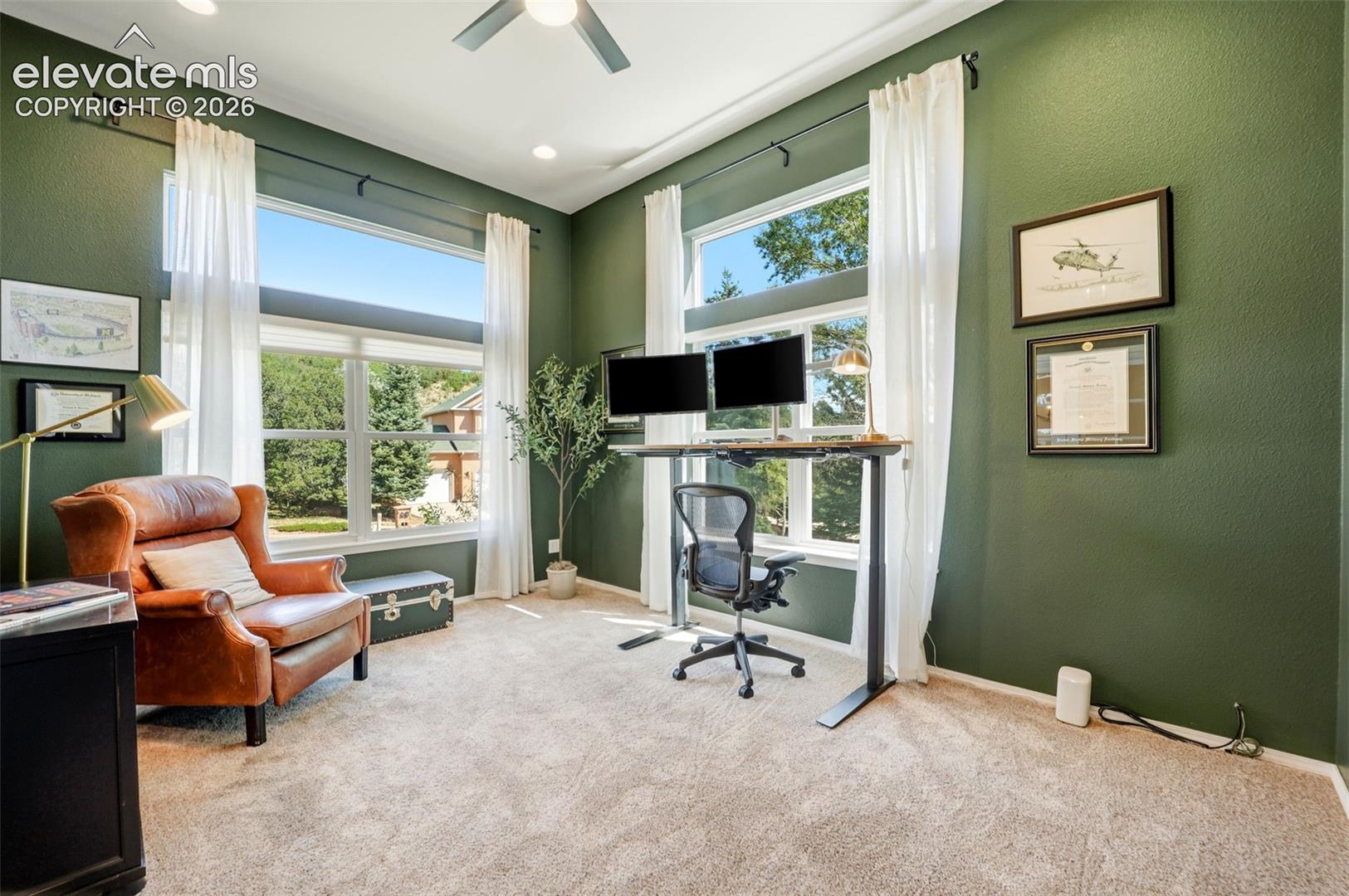 Office at the front of the home featuring high ceilings