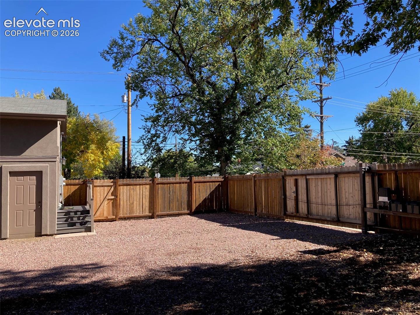 Gated access from side street for private parking