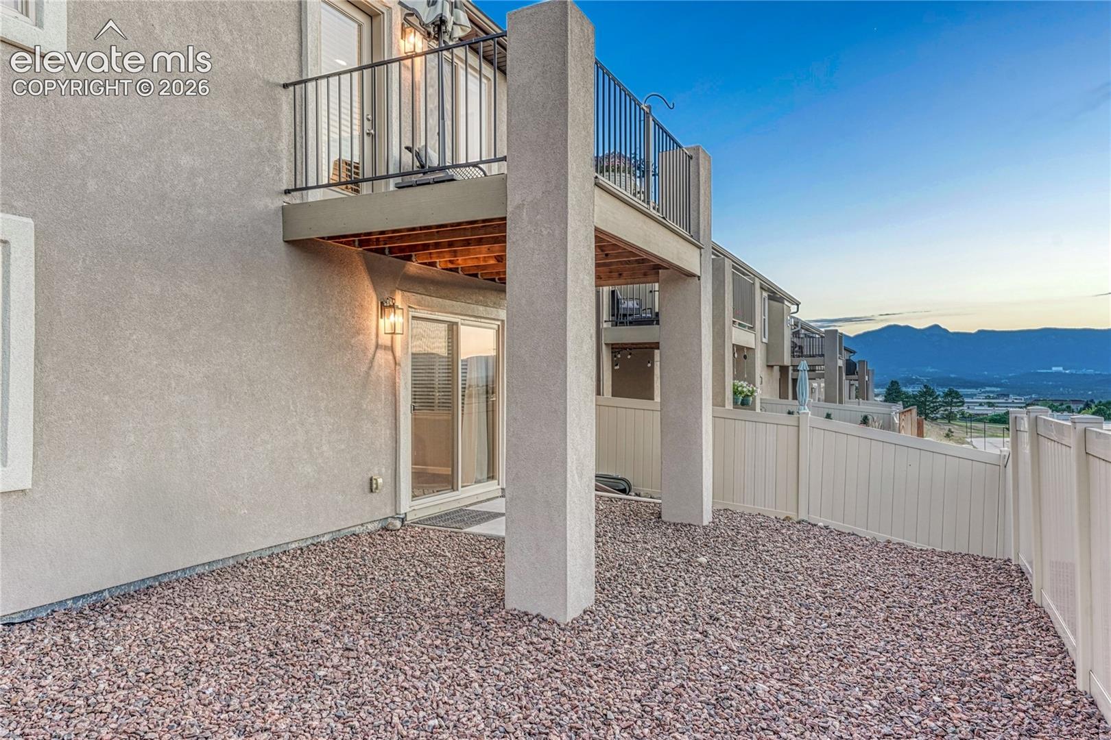The outdoor spaces combine a covered patio and elevated composite balcony to create multiple areas for enjoying Colorado's beautiful scenery.