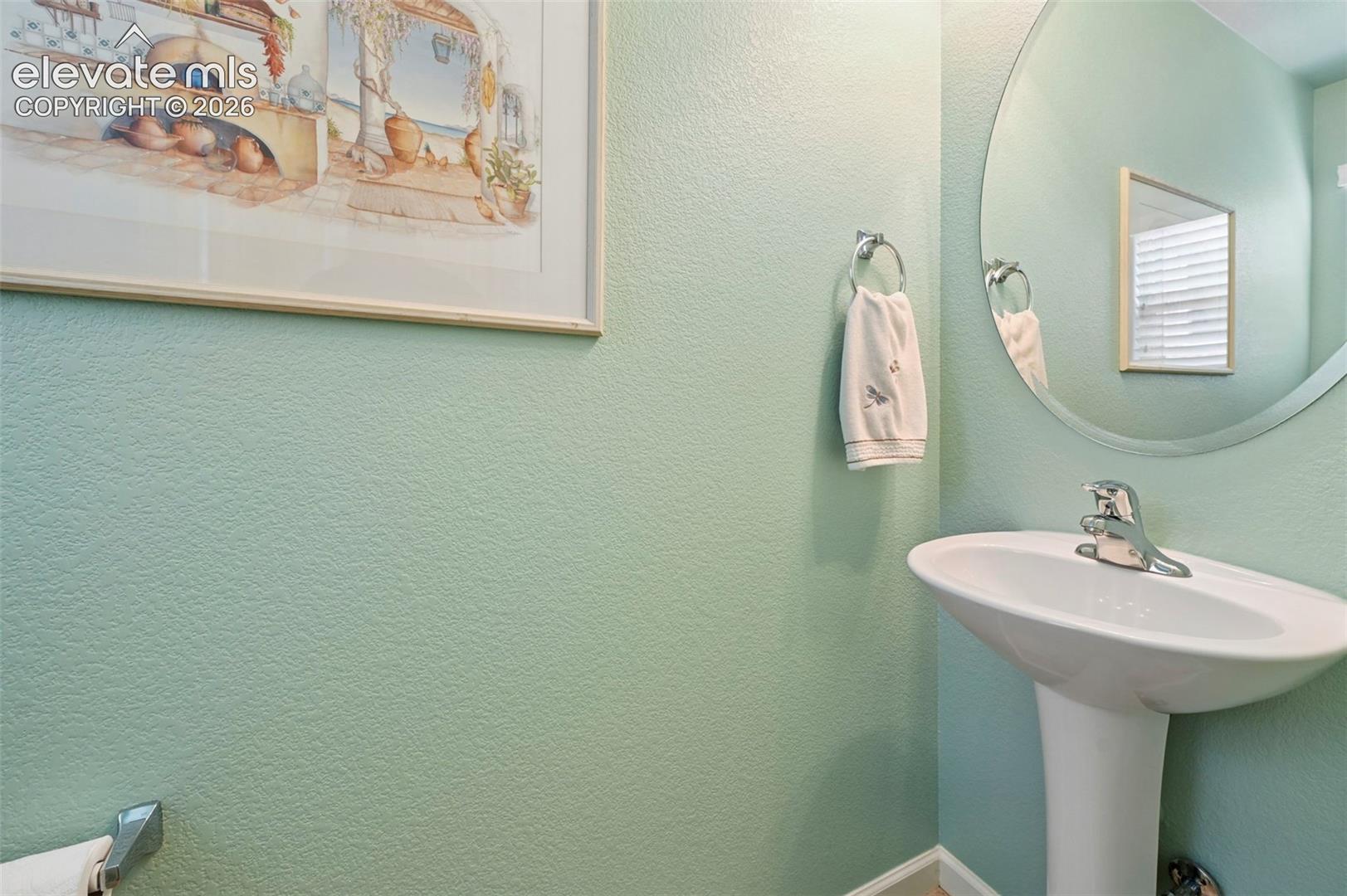 Powder room with Pedestal sink with chrome faucet 