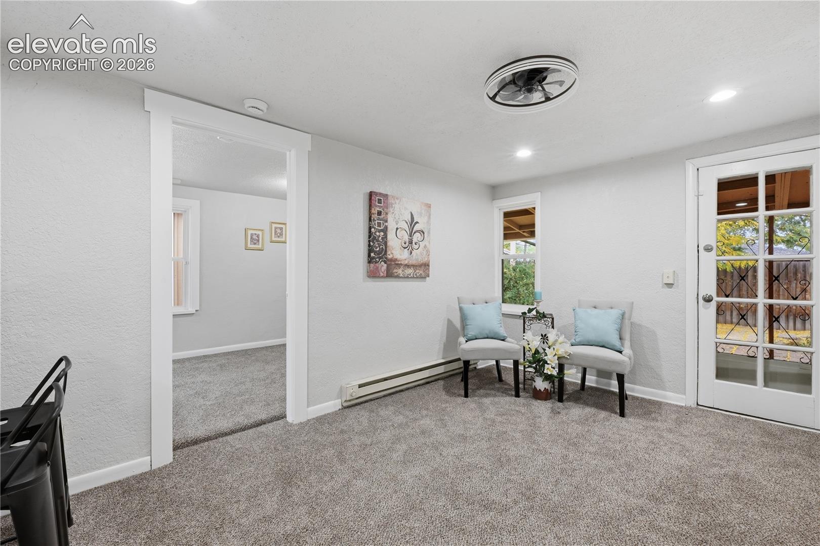 Another view of the great room in the apartment portion. The back door leads to the back yard.