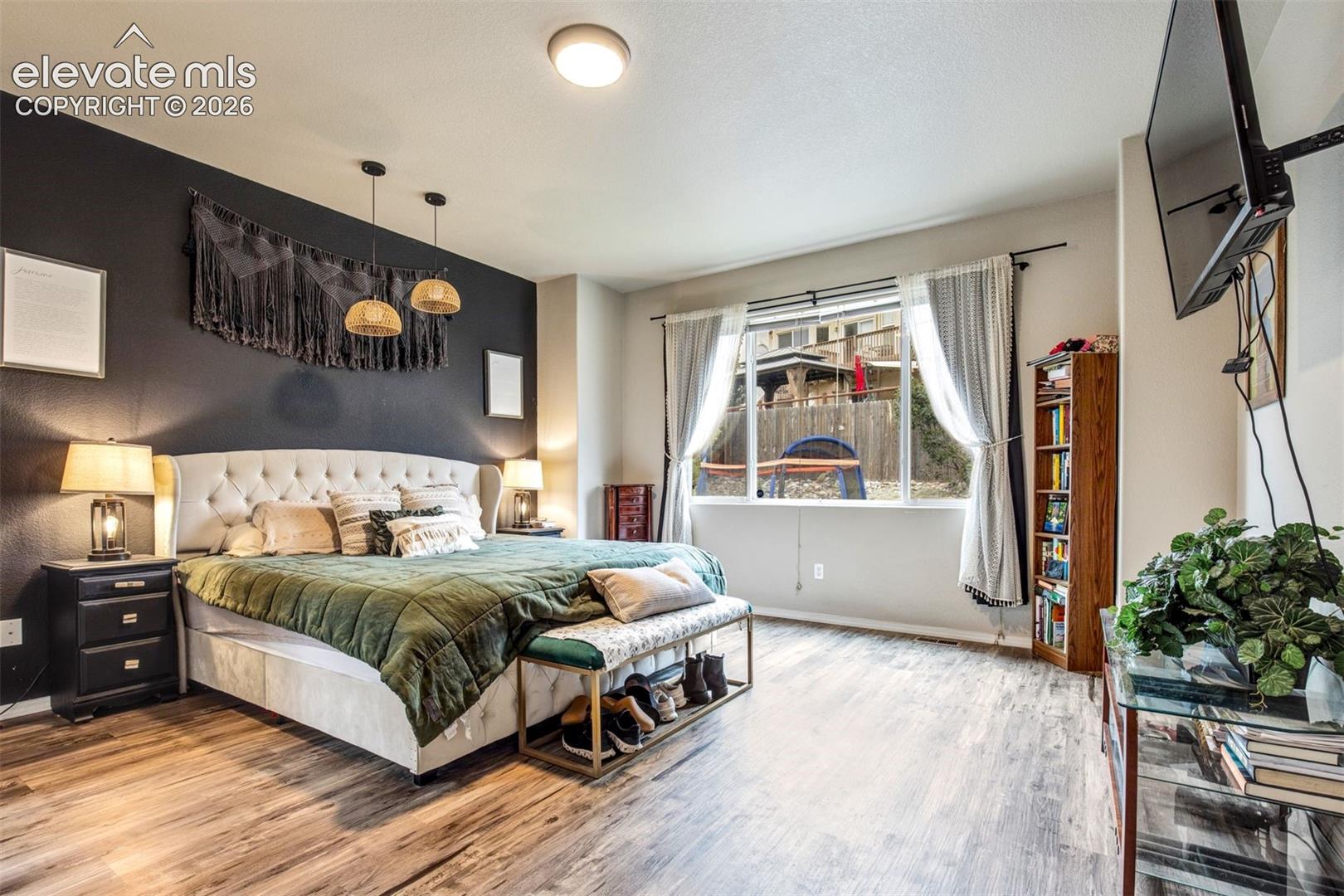Primary bedroom with accent wall