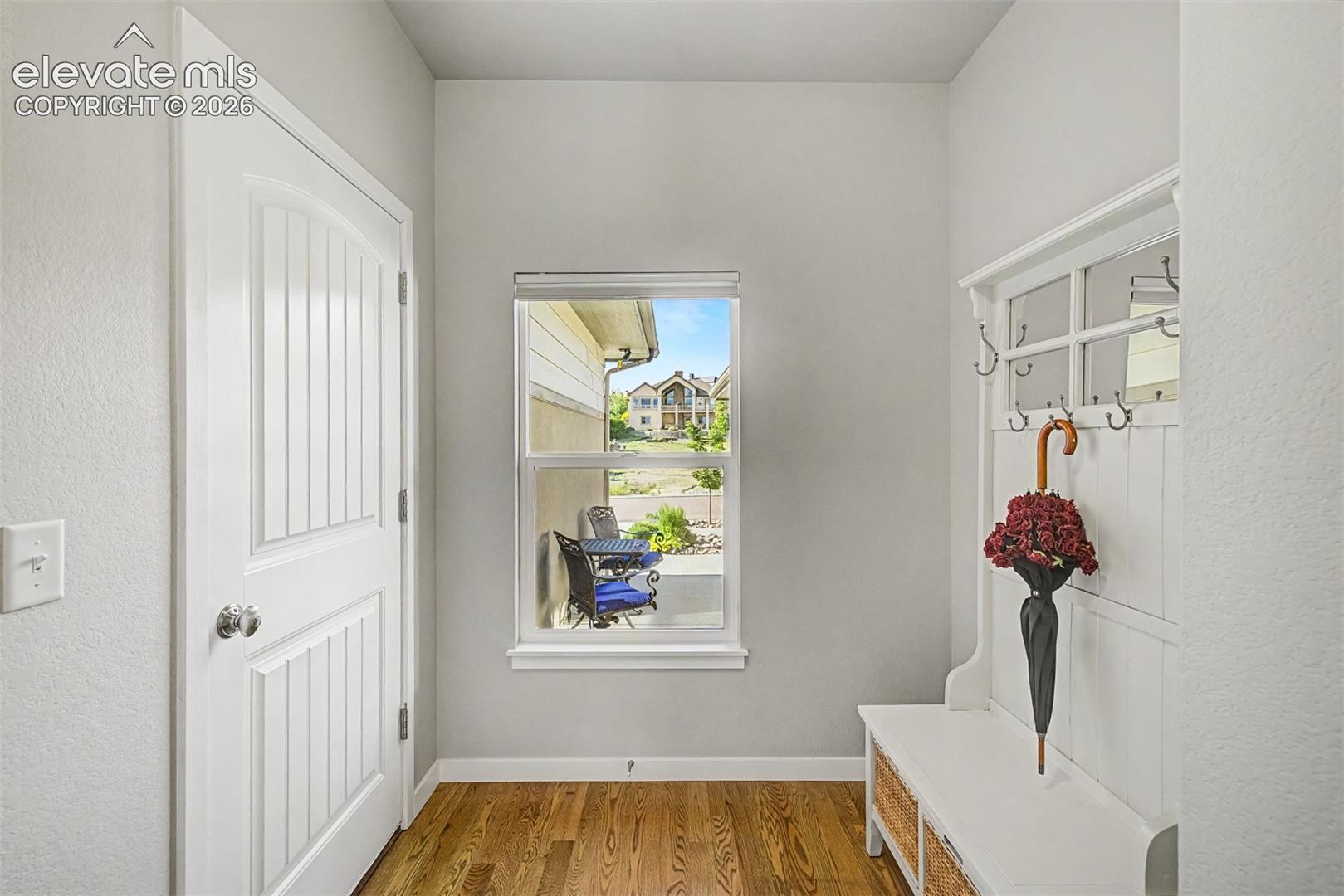 Thoughtfully designed mudroom off the garage keeps everyday drop-zone items conveniently tucked away and hidden from the front entry.