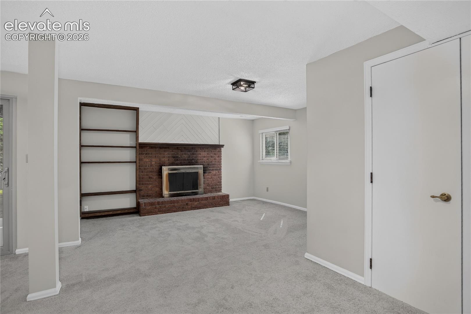 Family room w/ fireplace - lower level