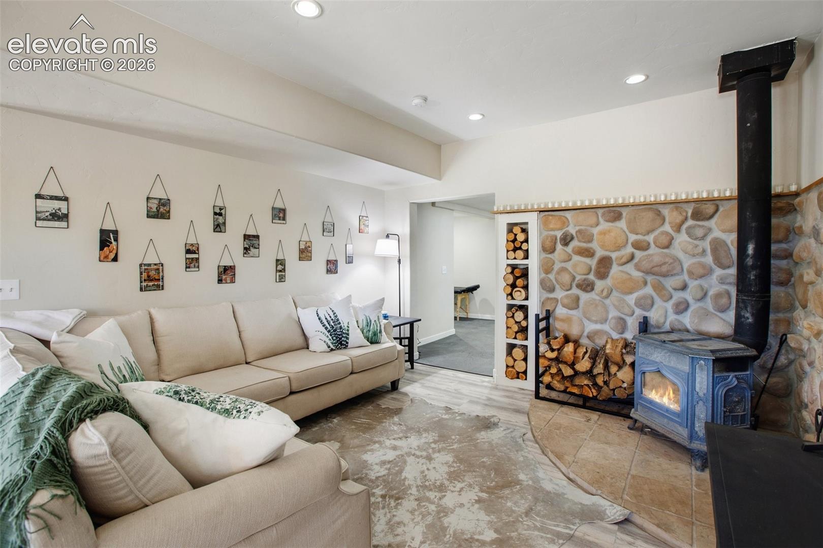 Lower level living room with wood burning fireplace