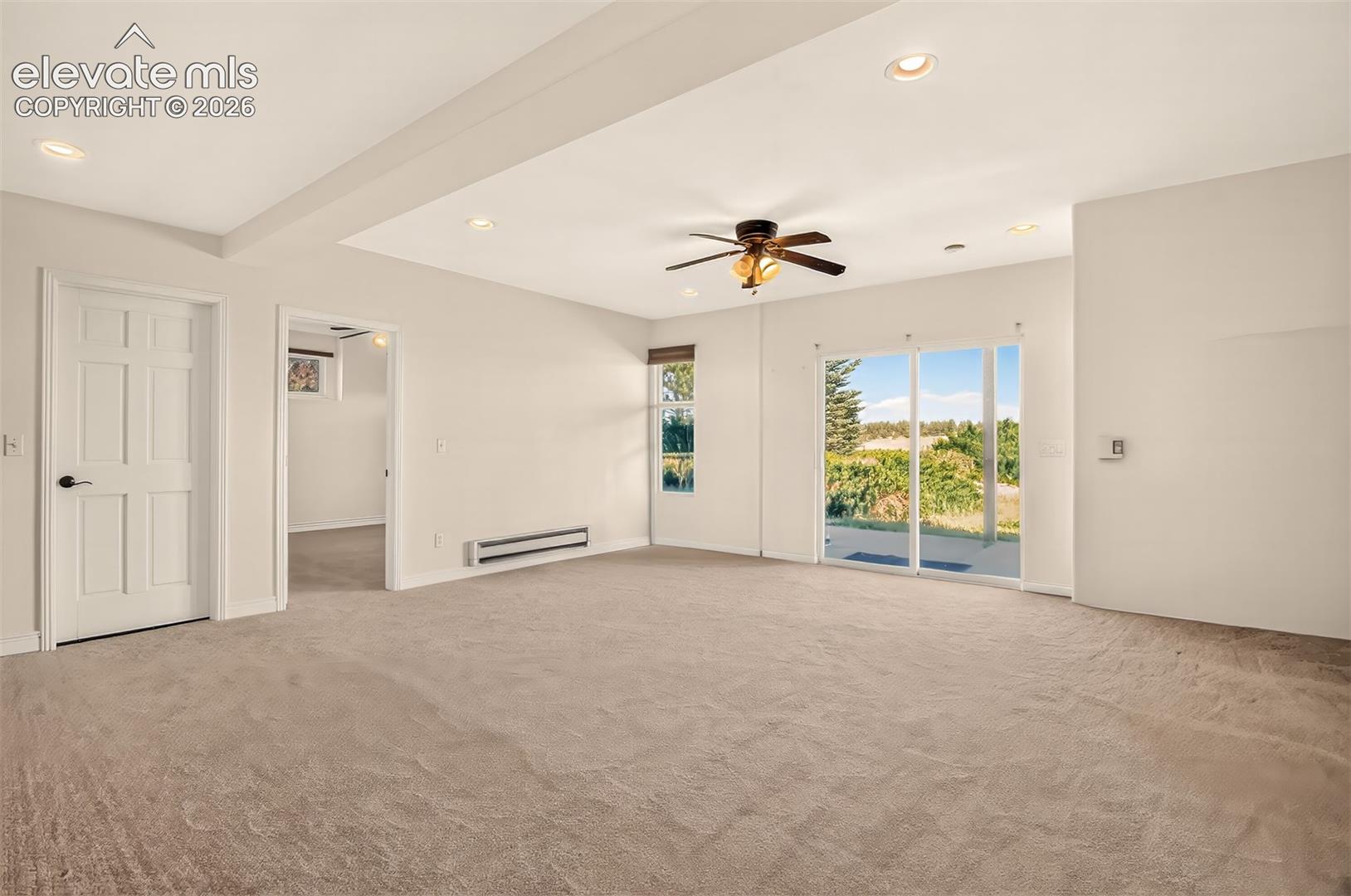 Walk-Out To The Back Patio, Bedroom And Storage Room On The Left