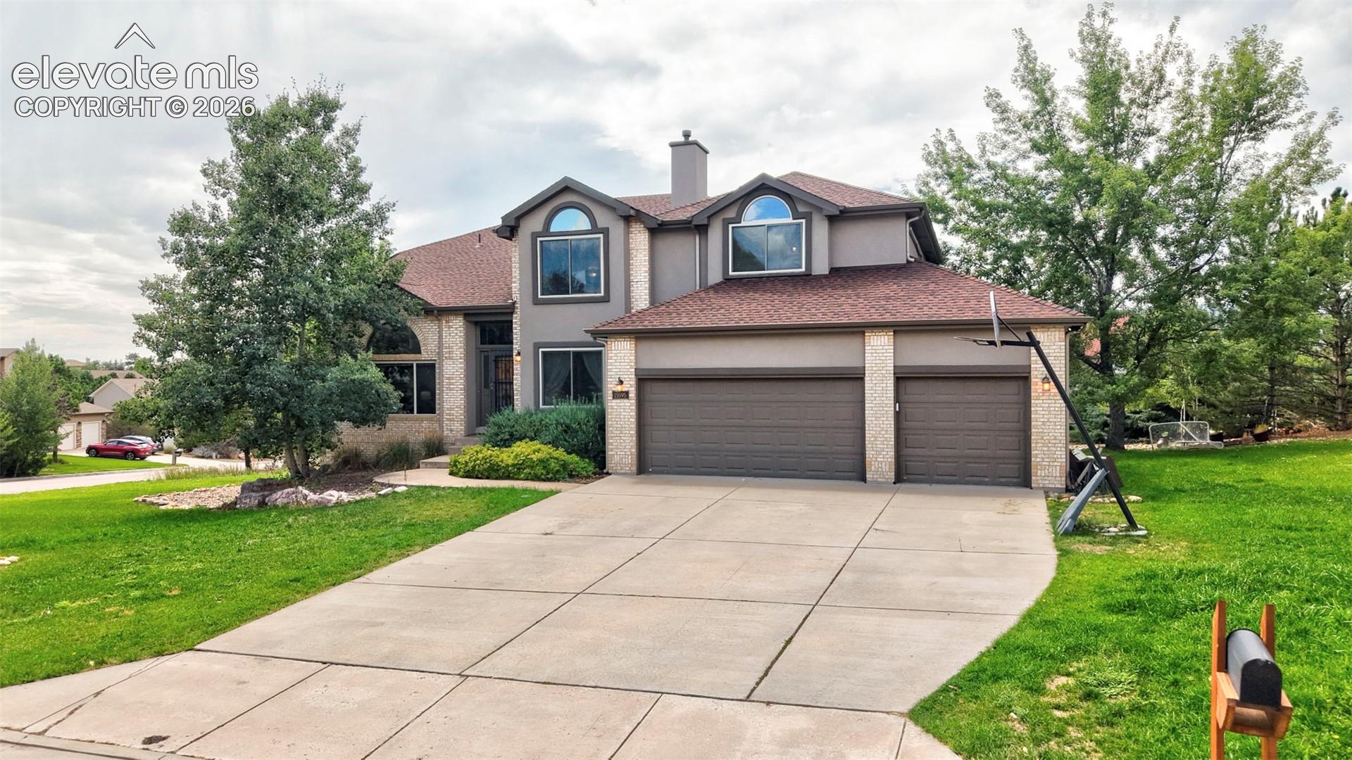 Two-story residence with a stucco and brick exterior