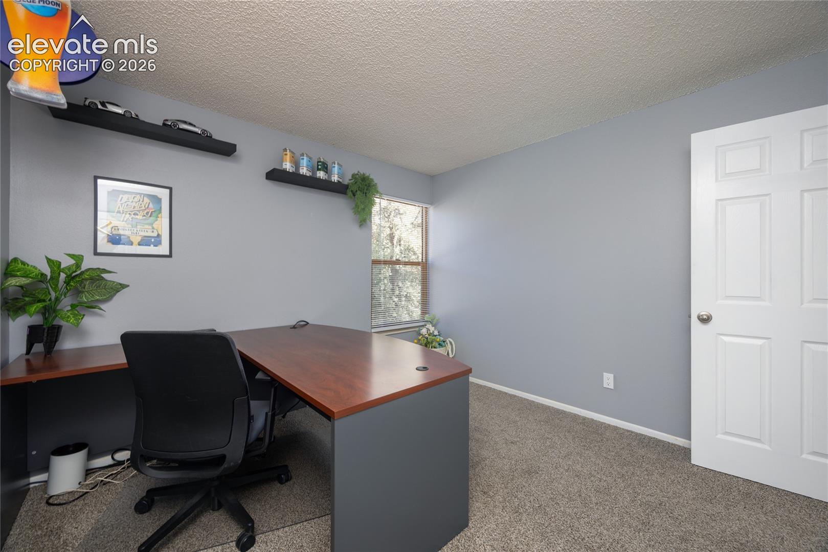 2nd Bedroom is being used as an office.