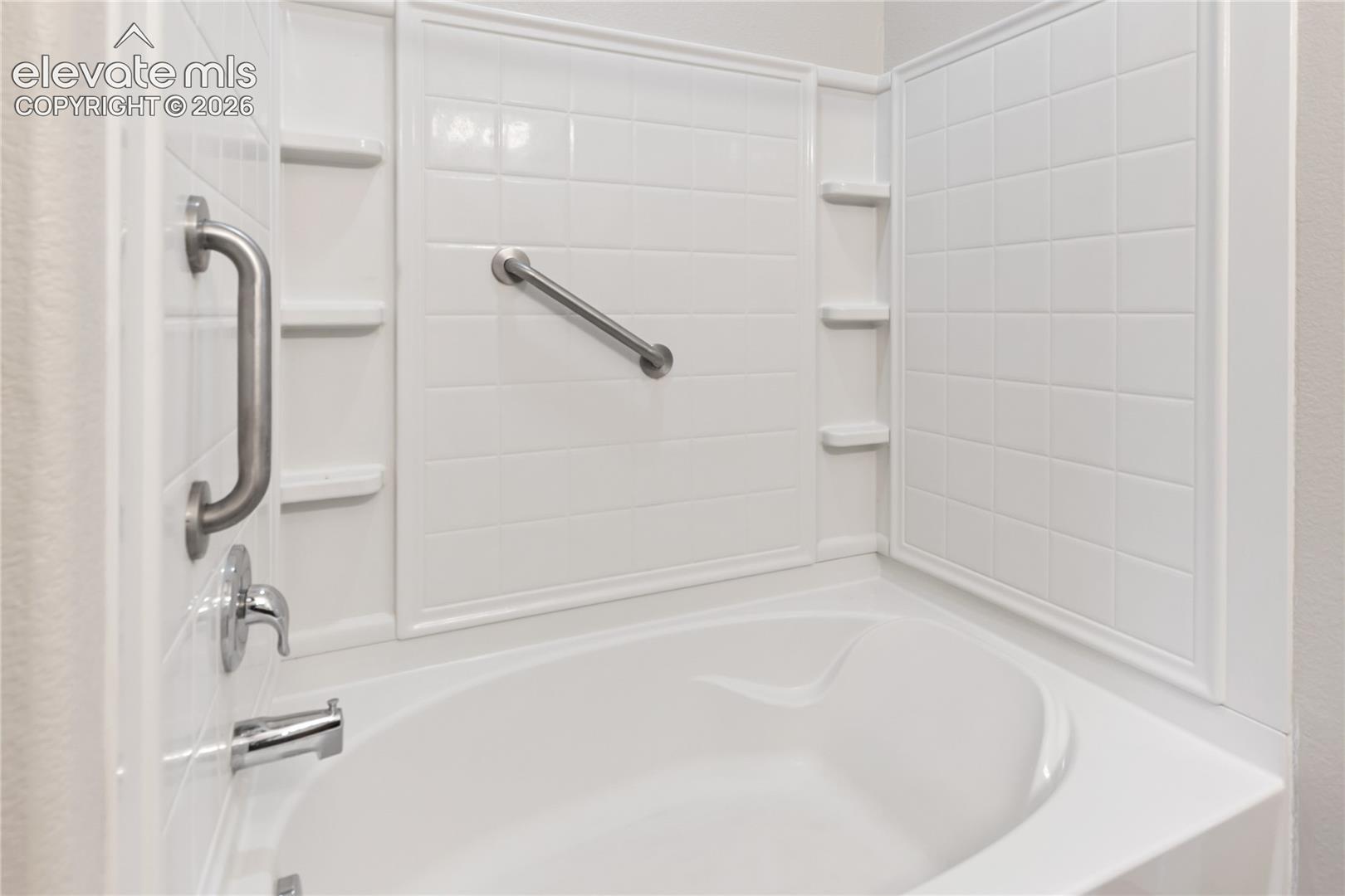 Primary bathroom features this oversized tub/shower
