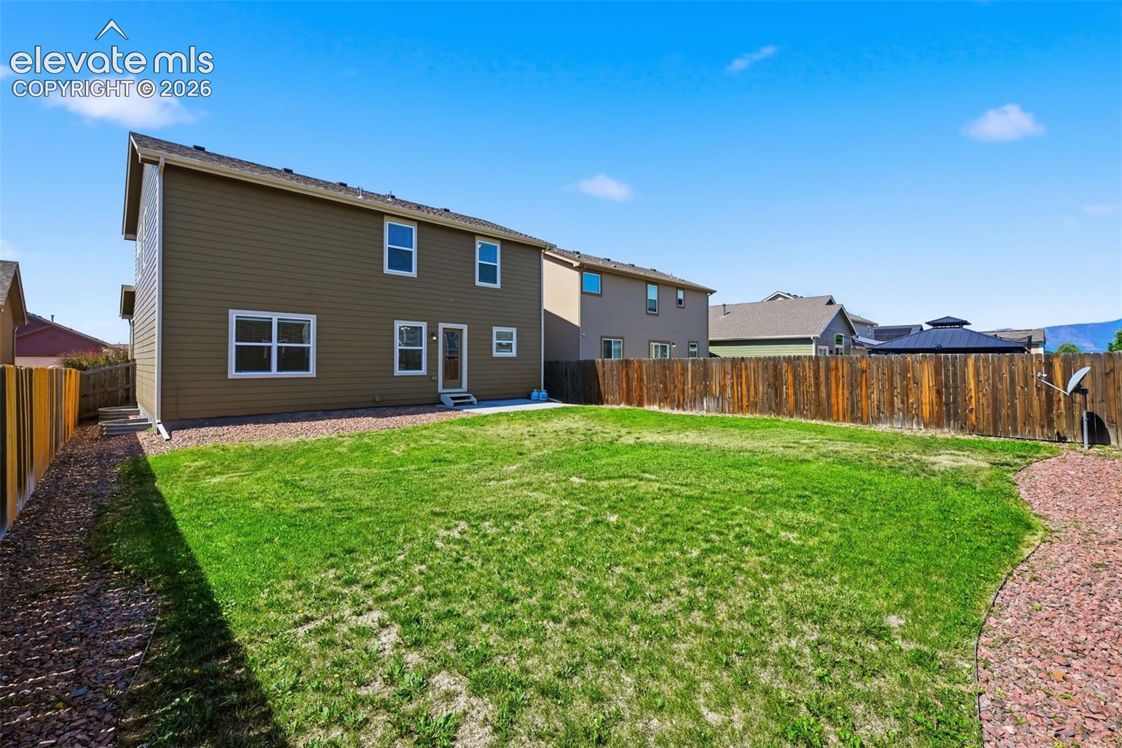 A large fenced backyard offers room for pets, play, gardening and outdoor enjoyment.