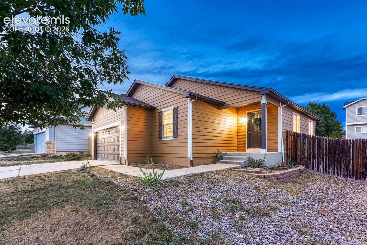 Low maintenance landscaping and covered front porch.