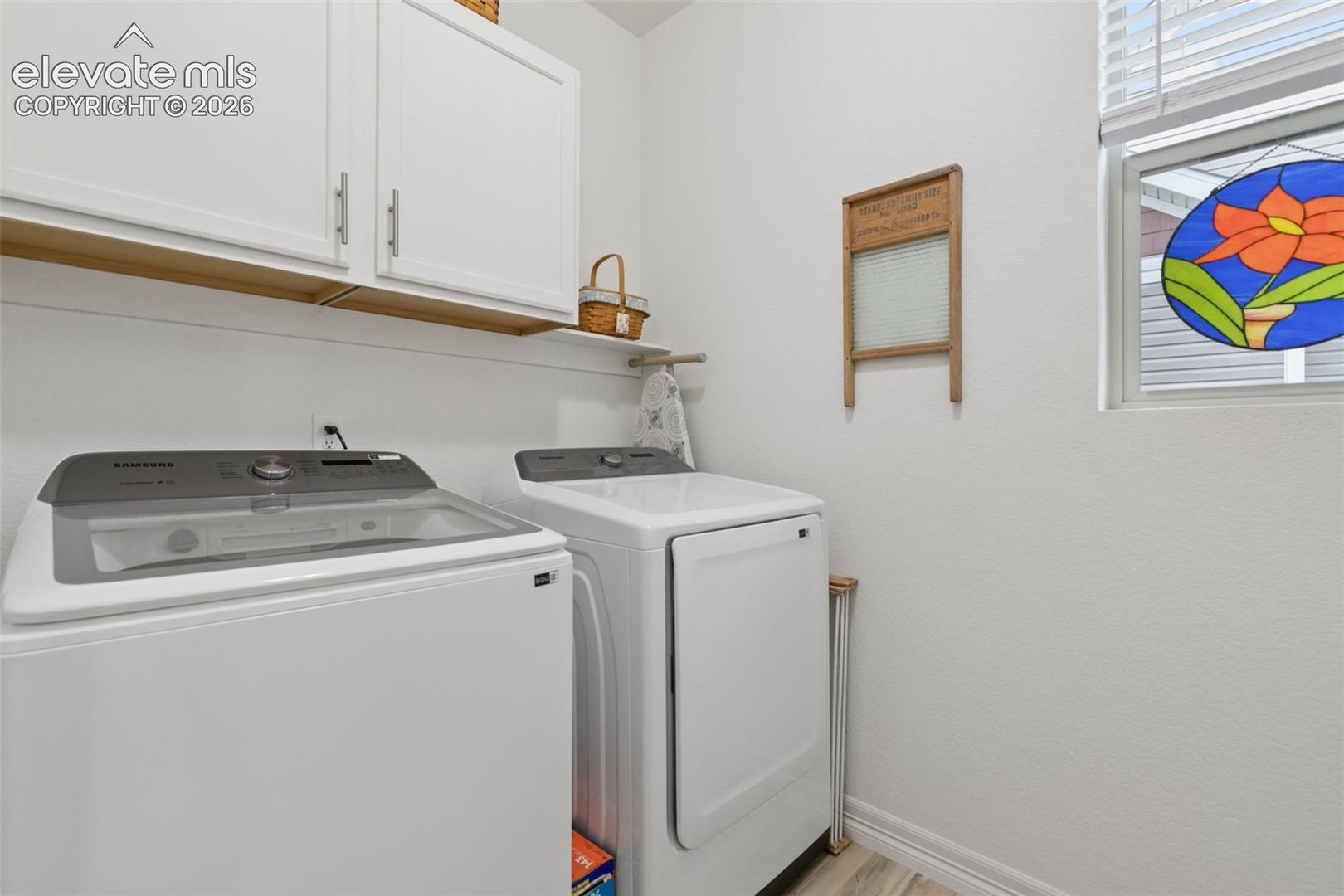 Laundry with additional cabinets