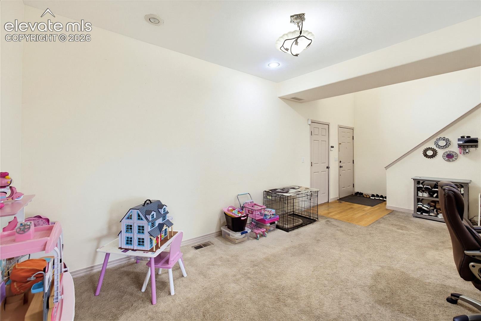 Recessed lighting, flush mount lighting, carpet flooring, wood-finish flooring, interior doors