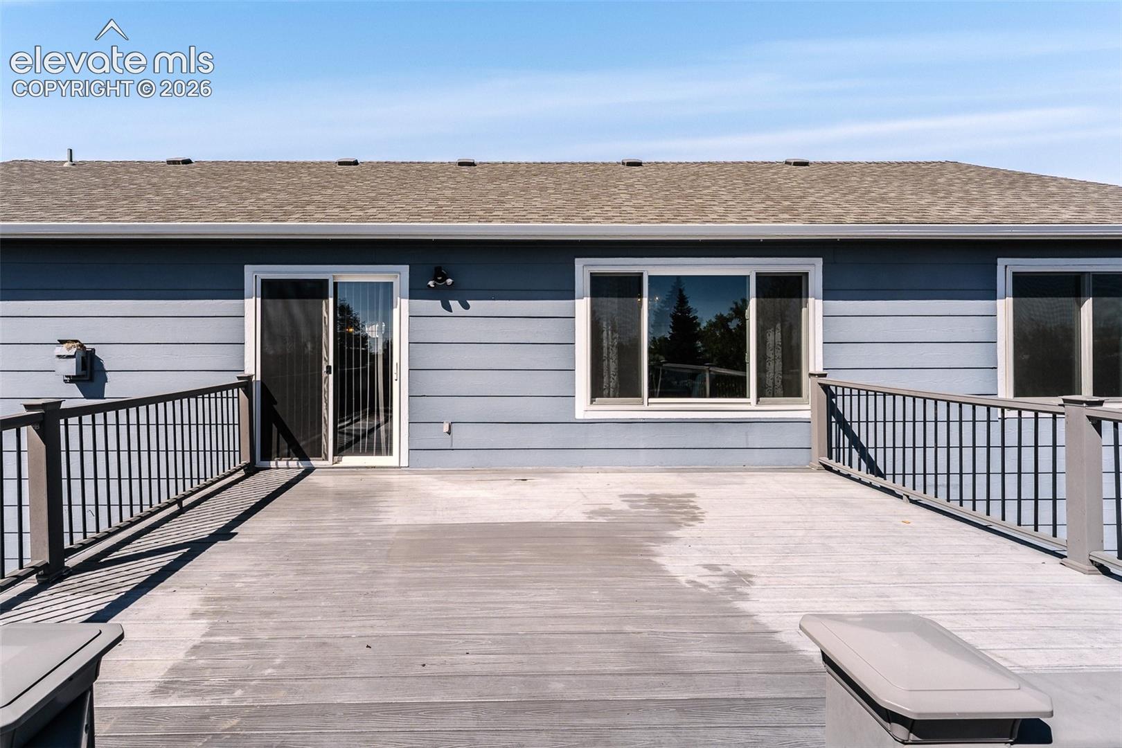 Backyard composite deck for outdoor dining and entertaining.
