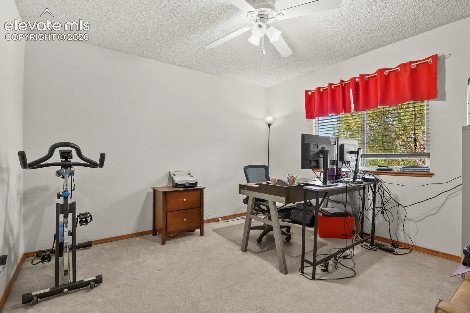 3rd secondary upstairs bedroom, currently being used as a home office.