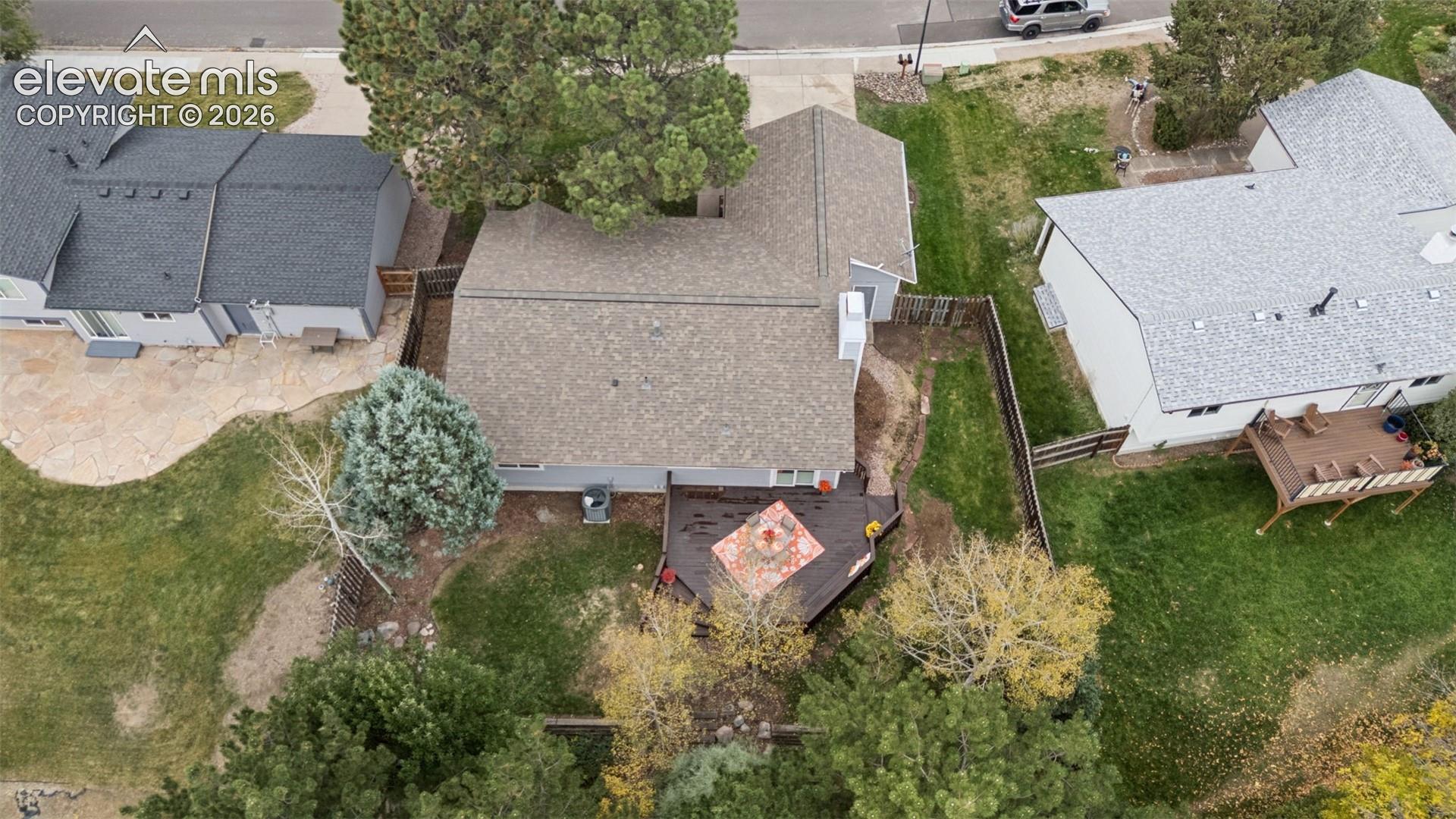 Mature trees grace this backyard adding privacy