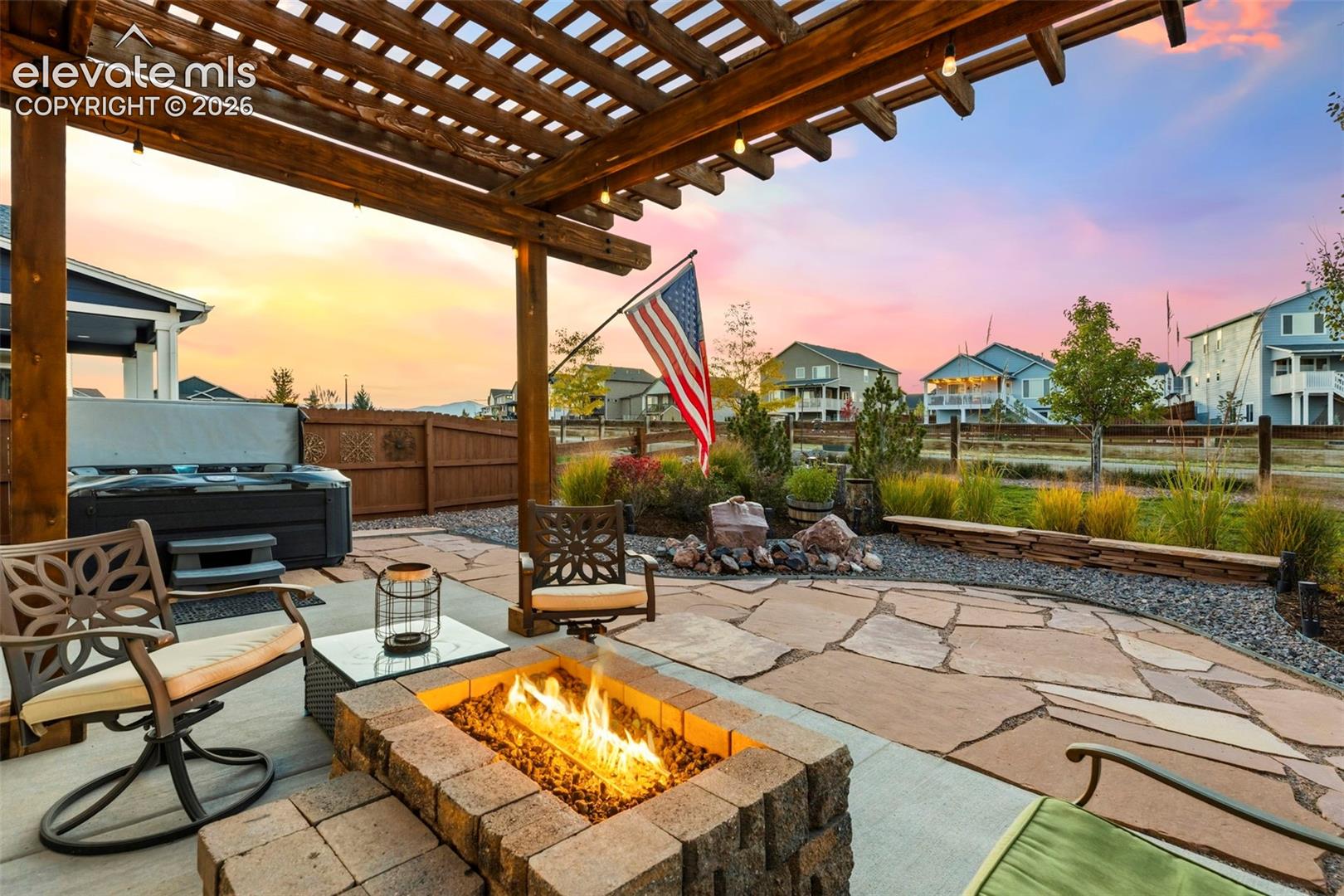 Built-in firepit underneath the pergola