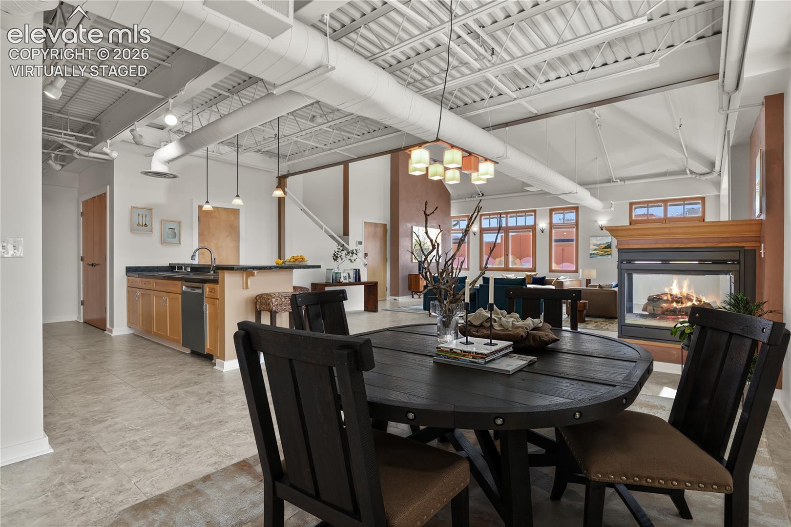 Enjoy the three-sided fireplace from multiple living spaces! Virtually Staged