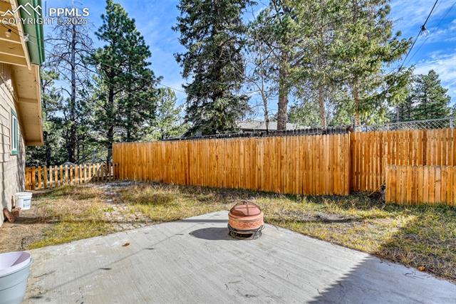 Fenced backyard featuring a patio area