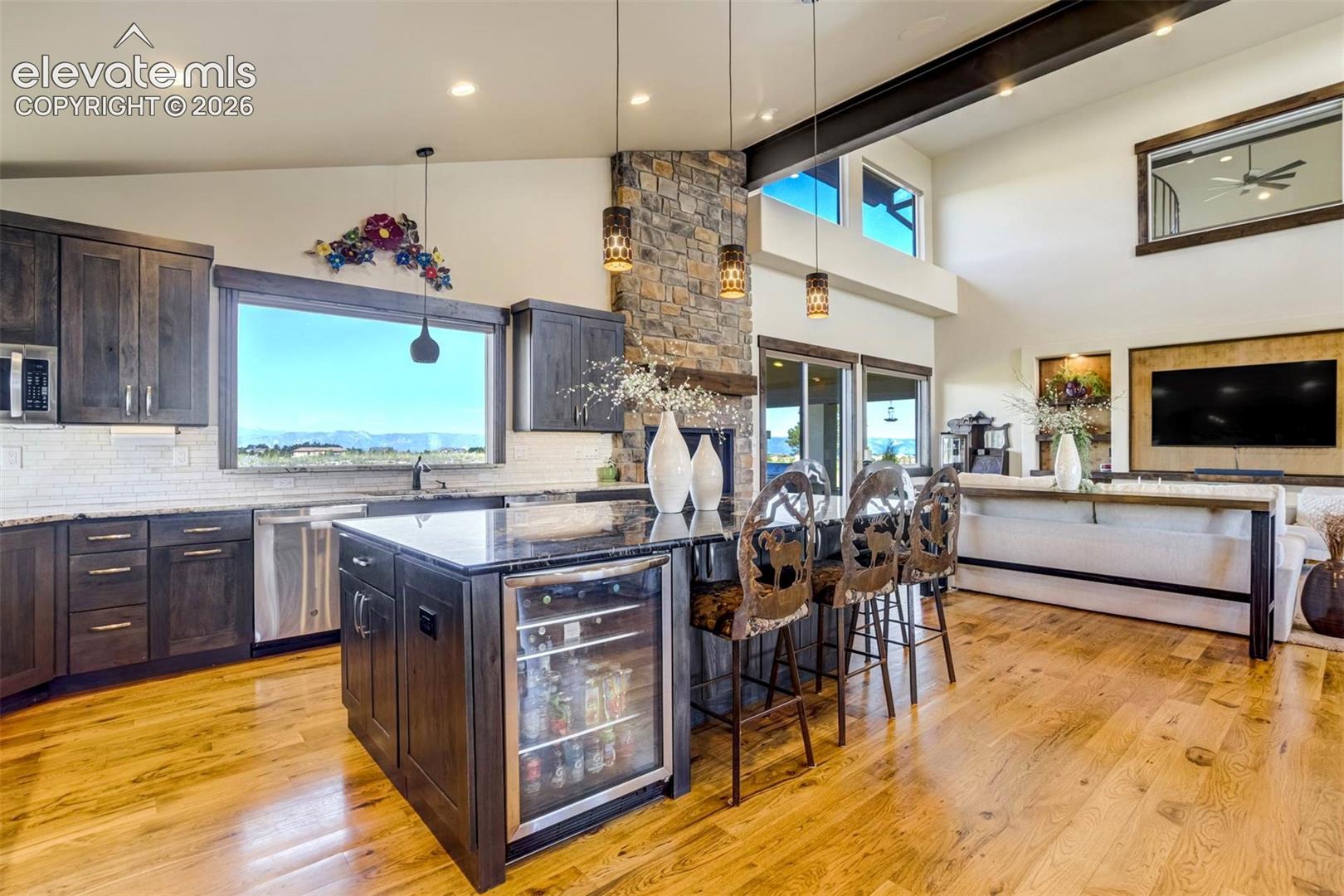 Gourmet kitchen with oversized island and beverage center