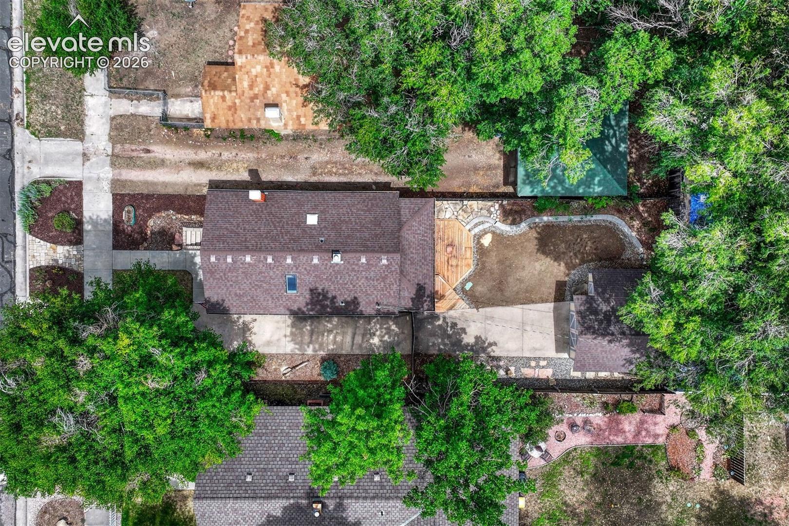 Large lot with concrete driveway and private backyard