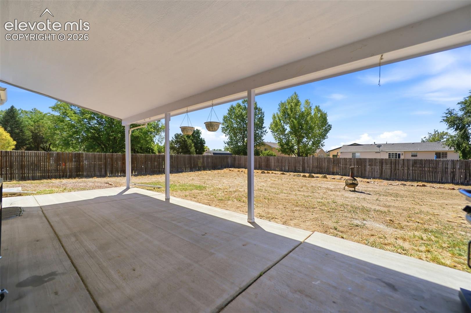 Covered Patio - 31' x 13' and back yard.