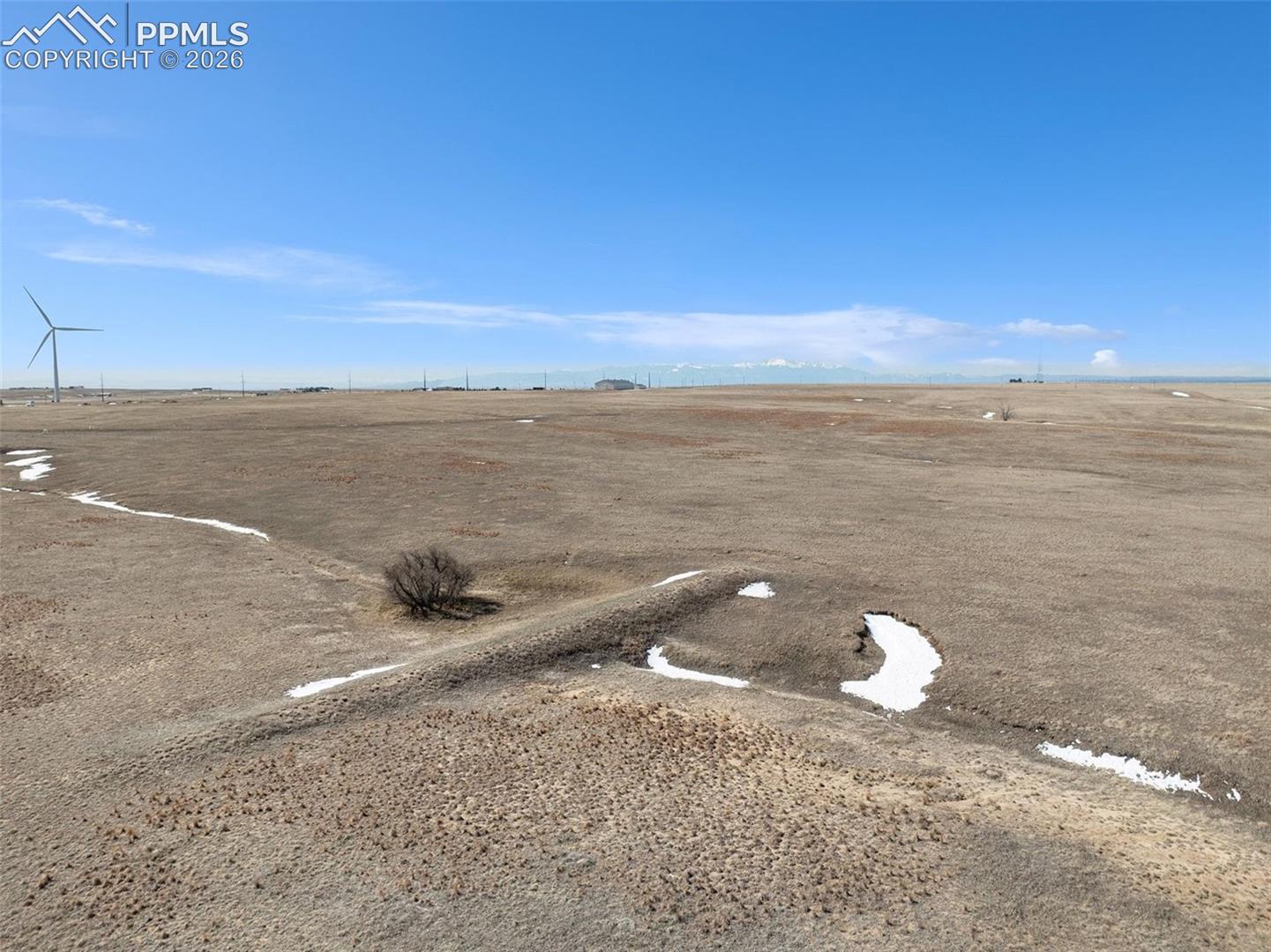 View showing open plains and surrounding rural acreage.