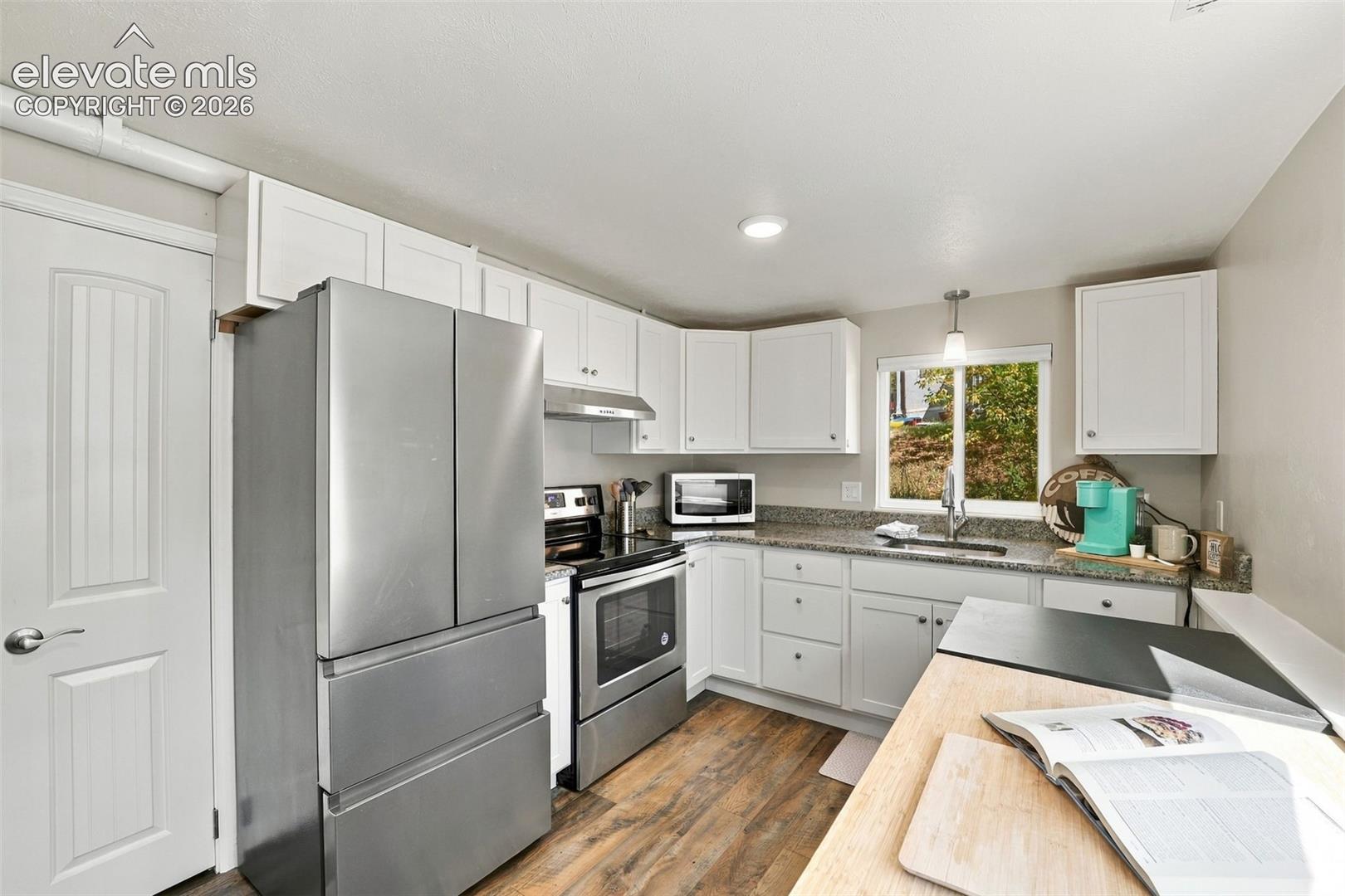 Lower level kitchen has luxury vinyl flooring and stainless steel appliances!