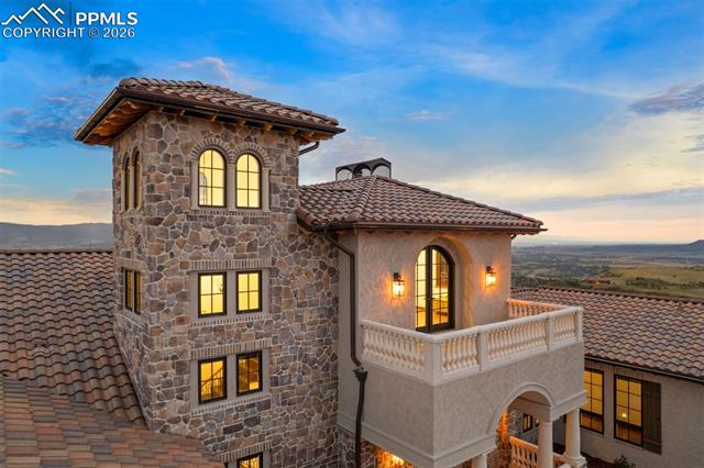 Aerial shot captures the full Mediterranean-inspired architecture.