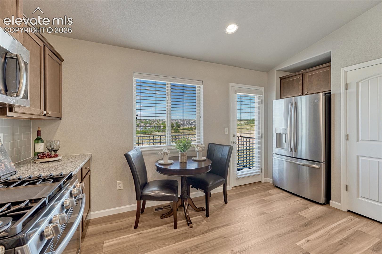 The dining nook extends the kitchen living space while you have the option to enjoy the mornings with views on the back deck.