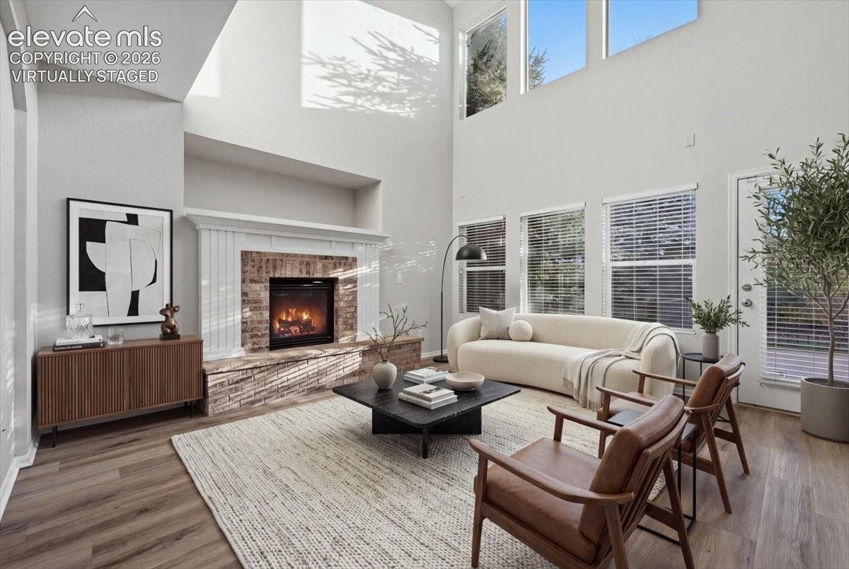 tall ceilings gas fireplace and large windows. Virtually staged