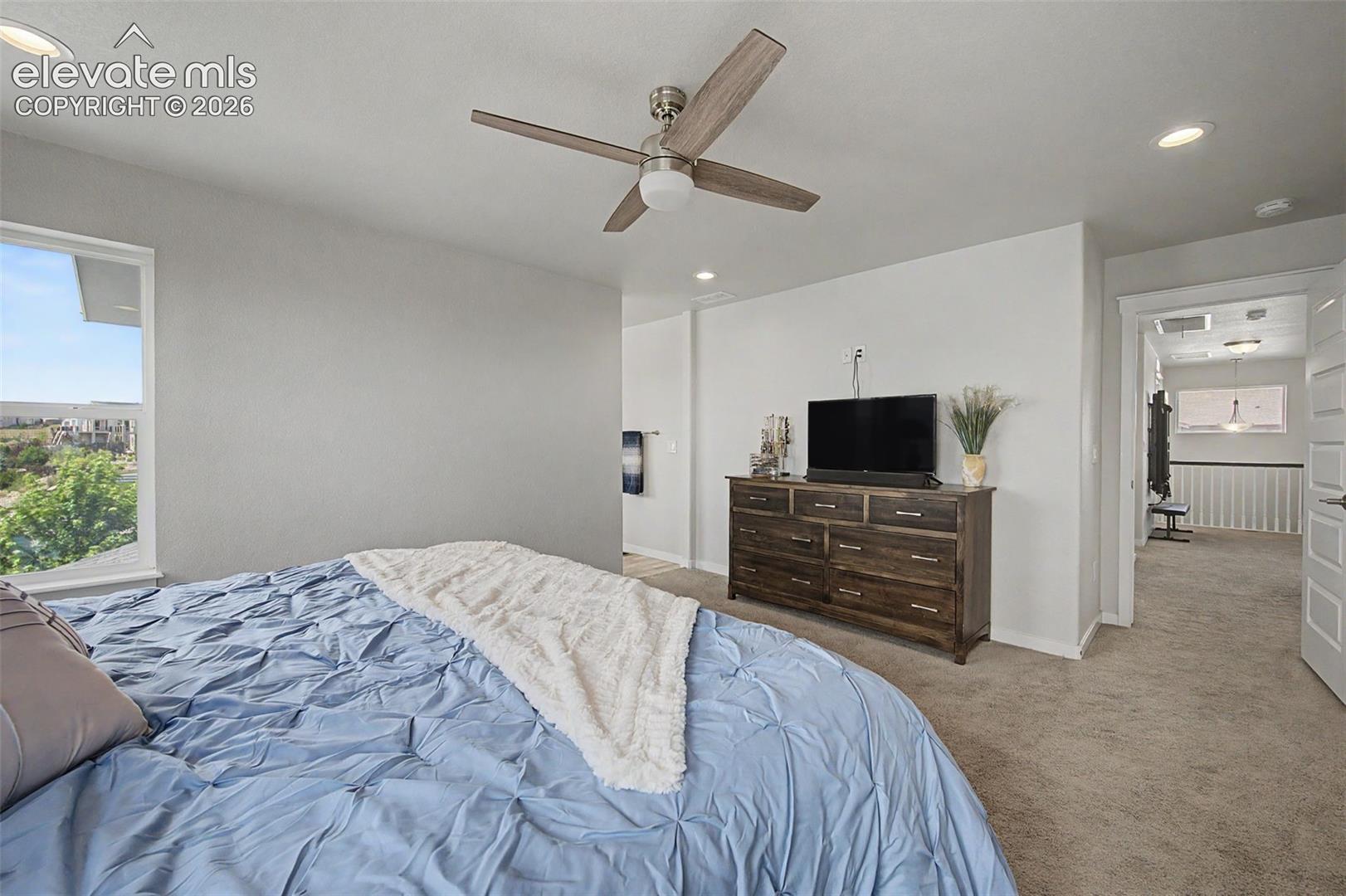 The upper level primary suite will be your private retreat.