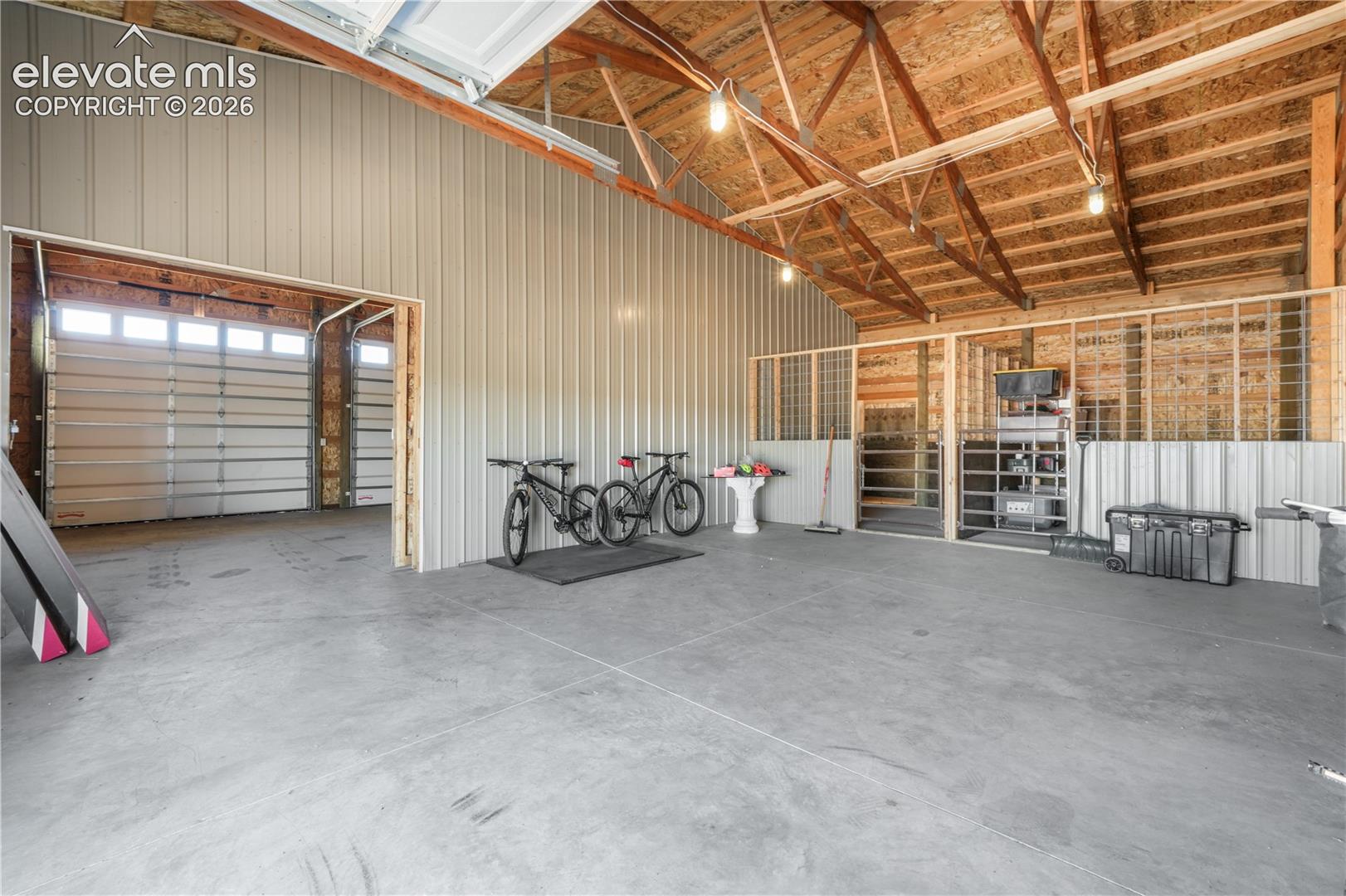 Concrete Flooring and 3 Garage Doors