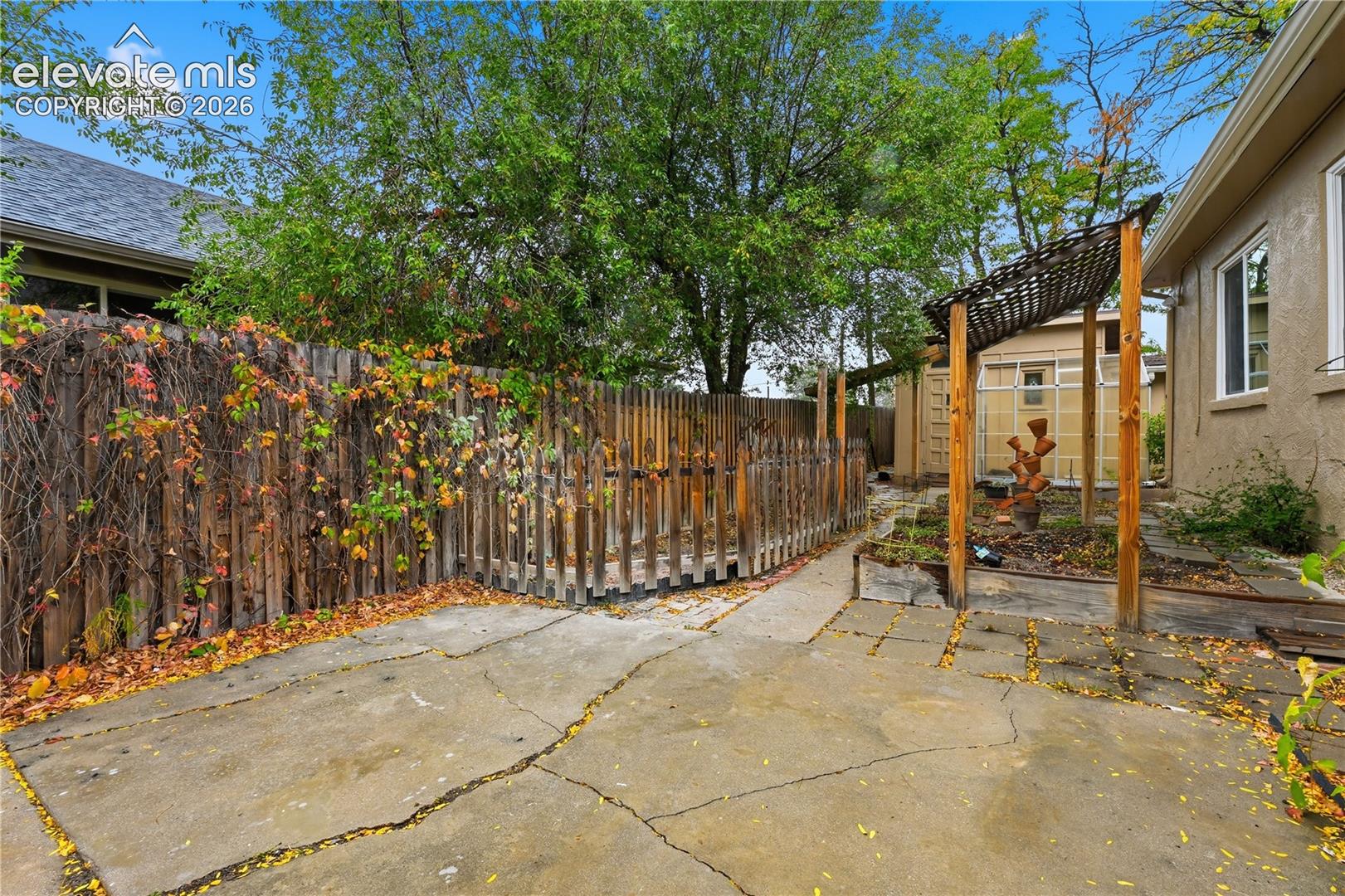 Gardens and walking paths surround this home.