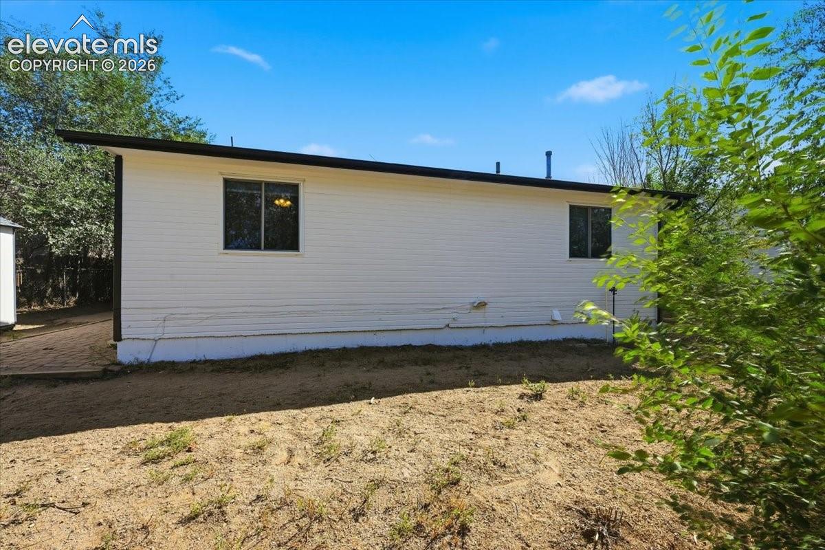 Rear of home and backyard. 