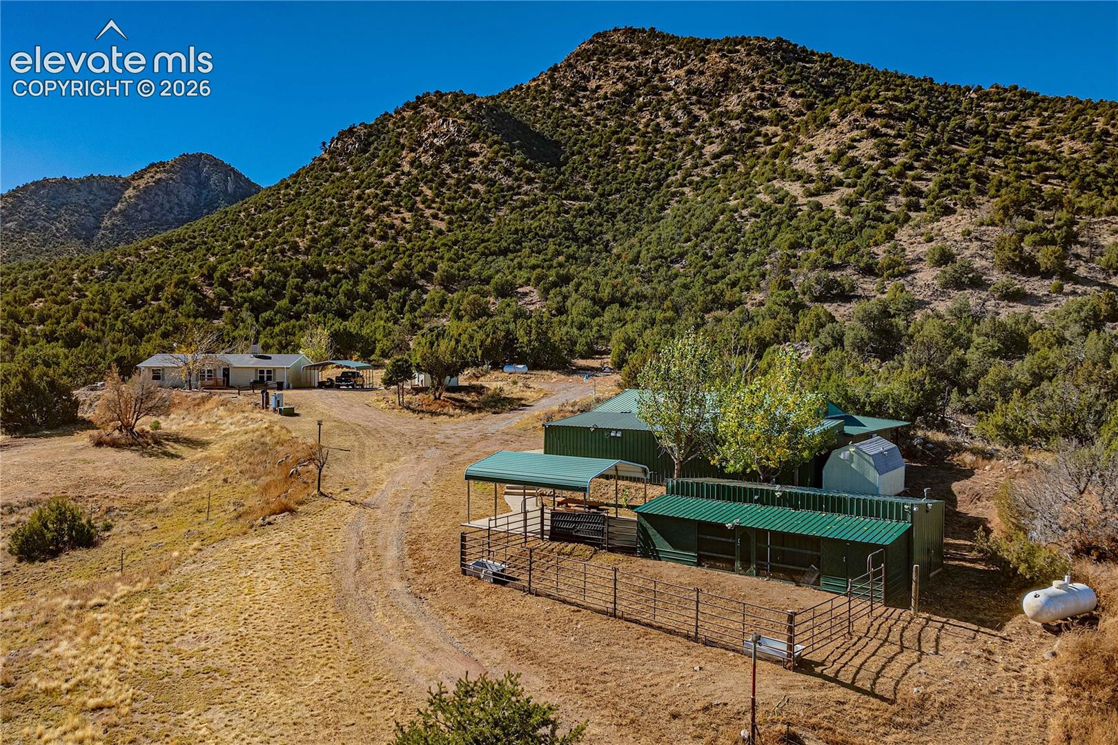 Property view of mountains with a rural view