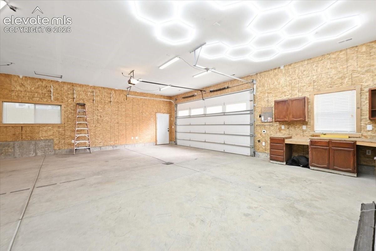 9x18 garage door. 30.5' deep. 50 and 30 amp plugs, water run off drain
