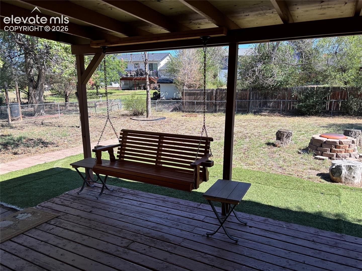 Amazing, peaceful, useable backyard.  The wooden swing is included!  Covered deck.