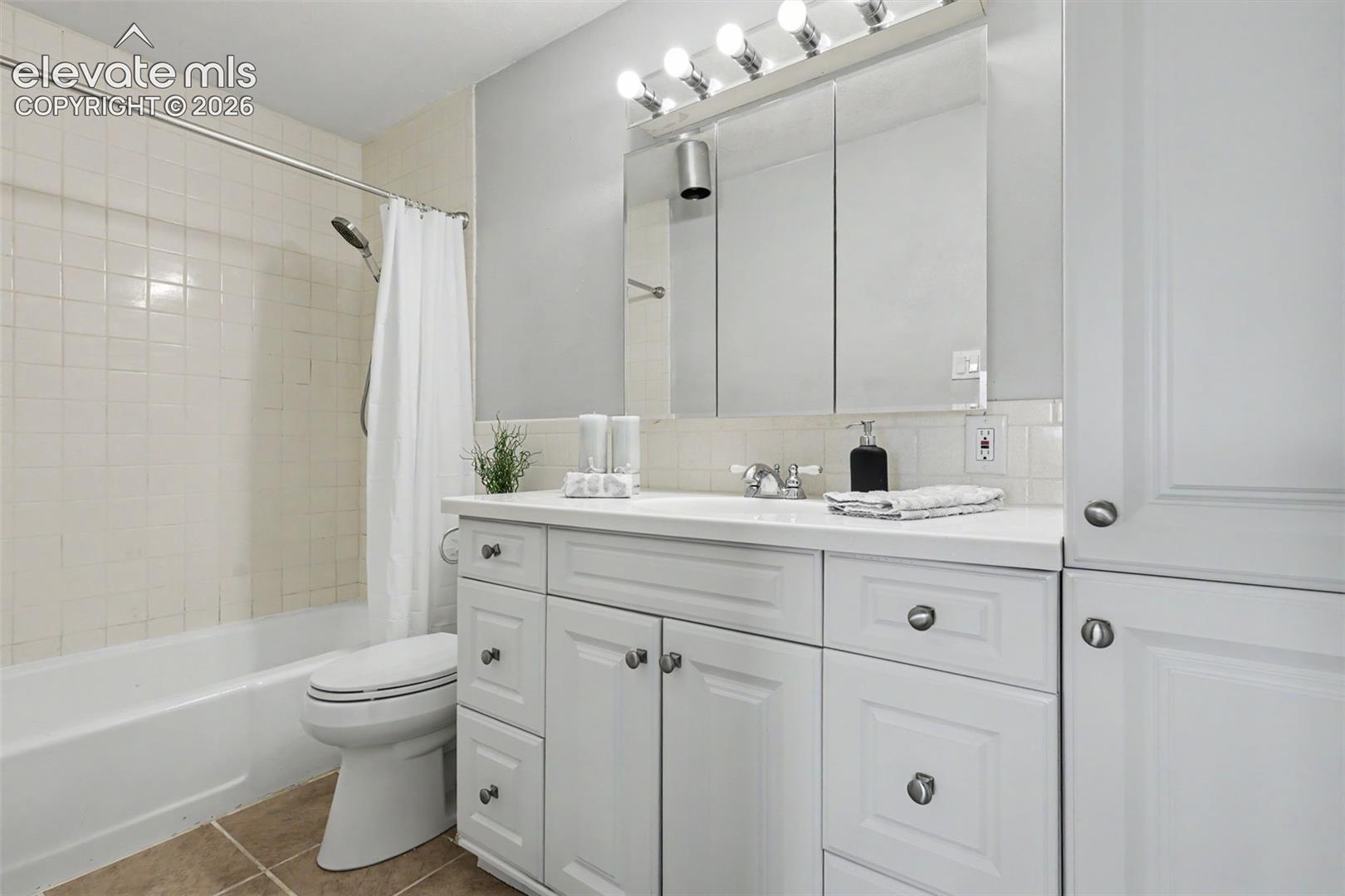 The full-sized Bathroom has an abundance of cupboard space for storage!