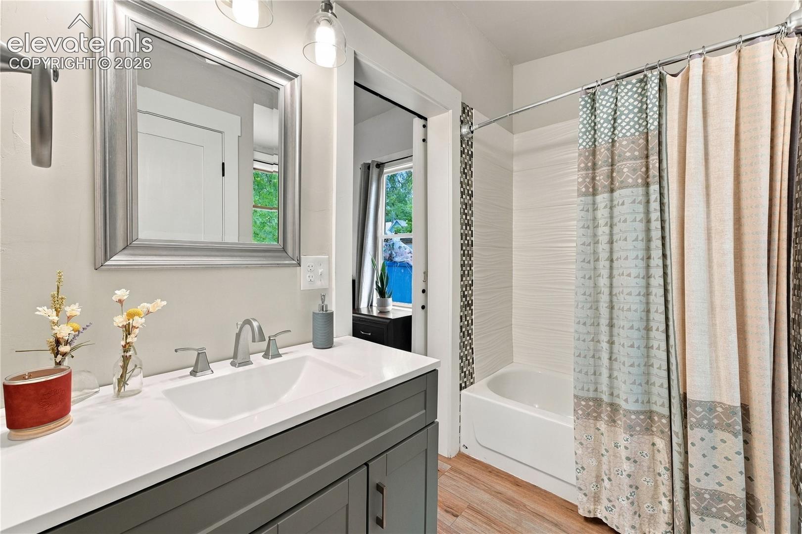 Fully renovated full bathroom with laundry closet. 