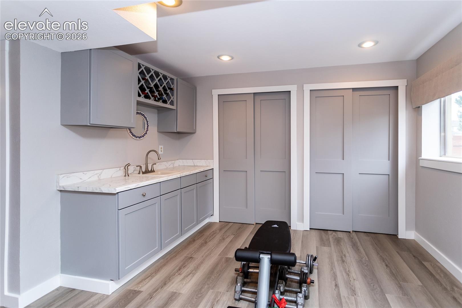 Workout Nook has plenty of Storage and convenient Wet Bar