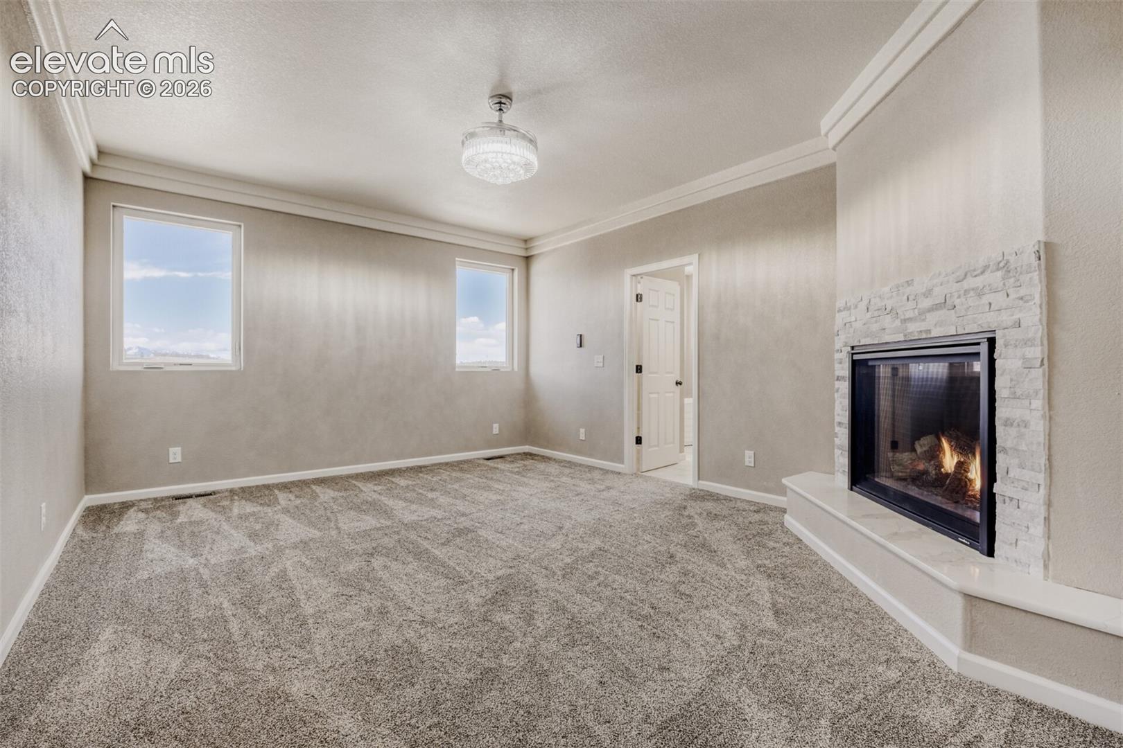 Primary Bedroom with fireplace, massive closet, lux 5-piece bath