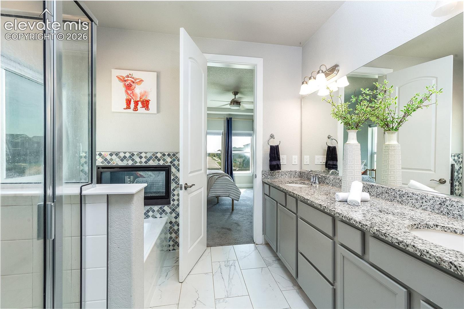 Dual vanity with integrated sinks and a speckled countertop