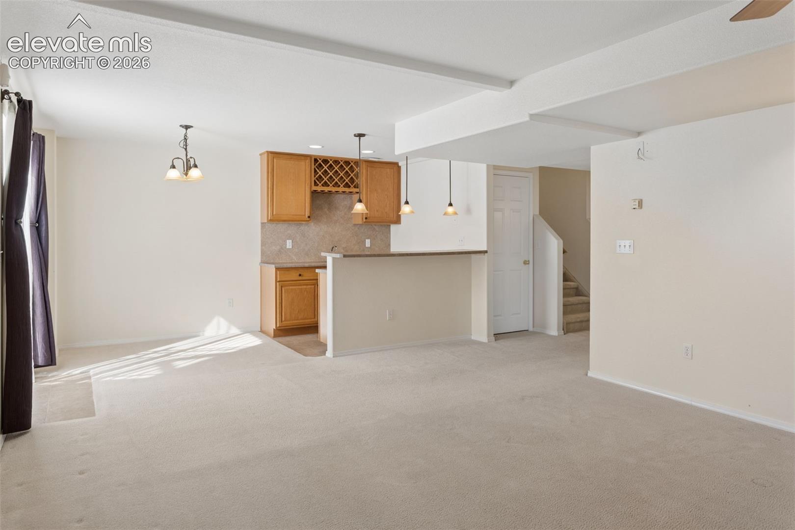 Basement area with walk out to back yard.  Wet bar with built in wine storage, Rec room or 2nd family room.