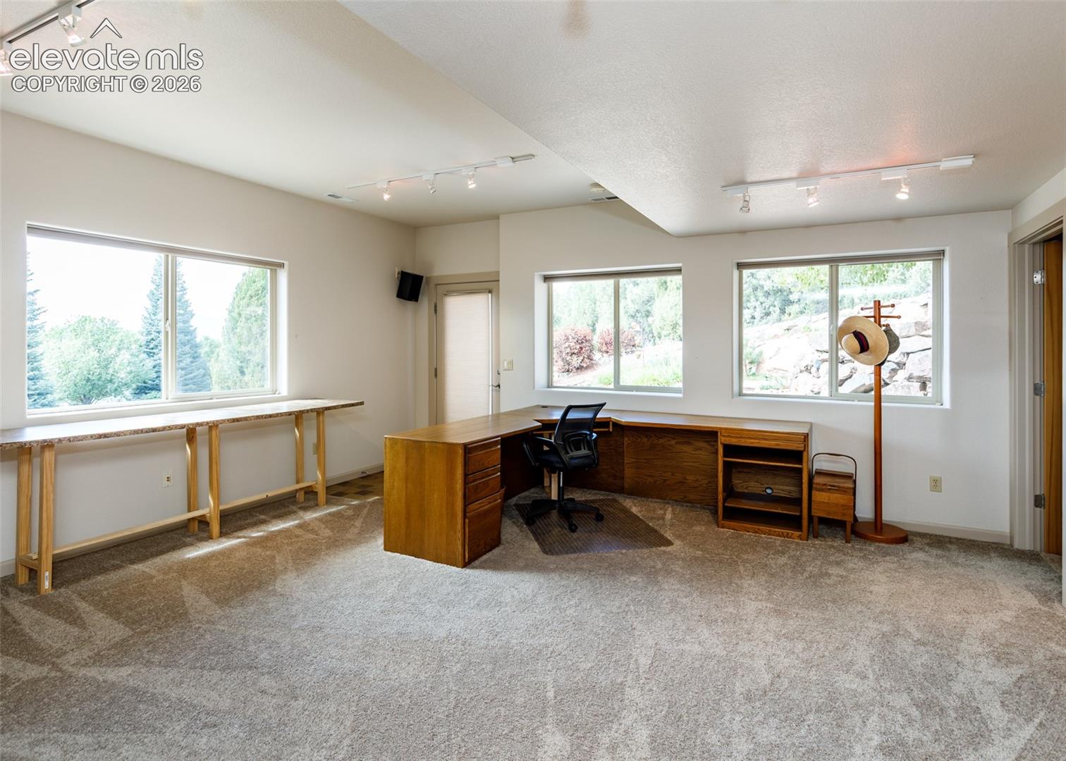 Versatile area in lower level family room is perfect for crafts, office or home business!