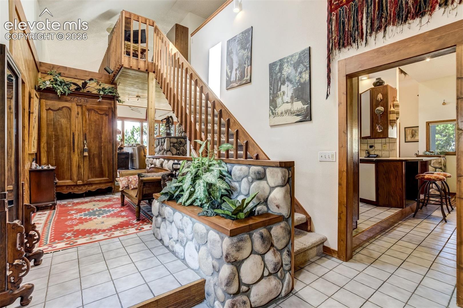 Natural wood and custom river rock accents throughout the home