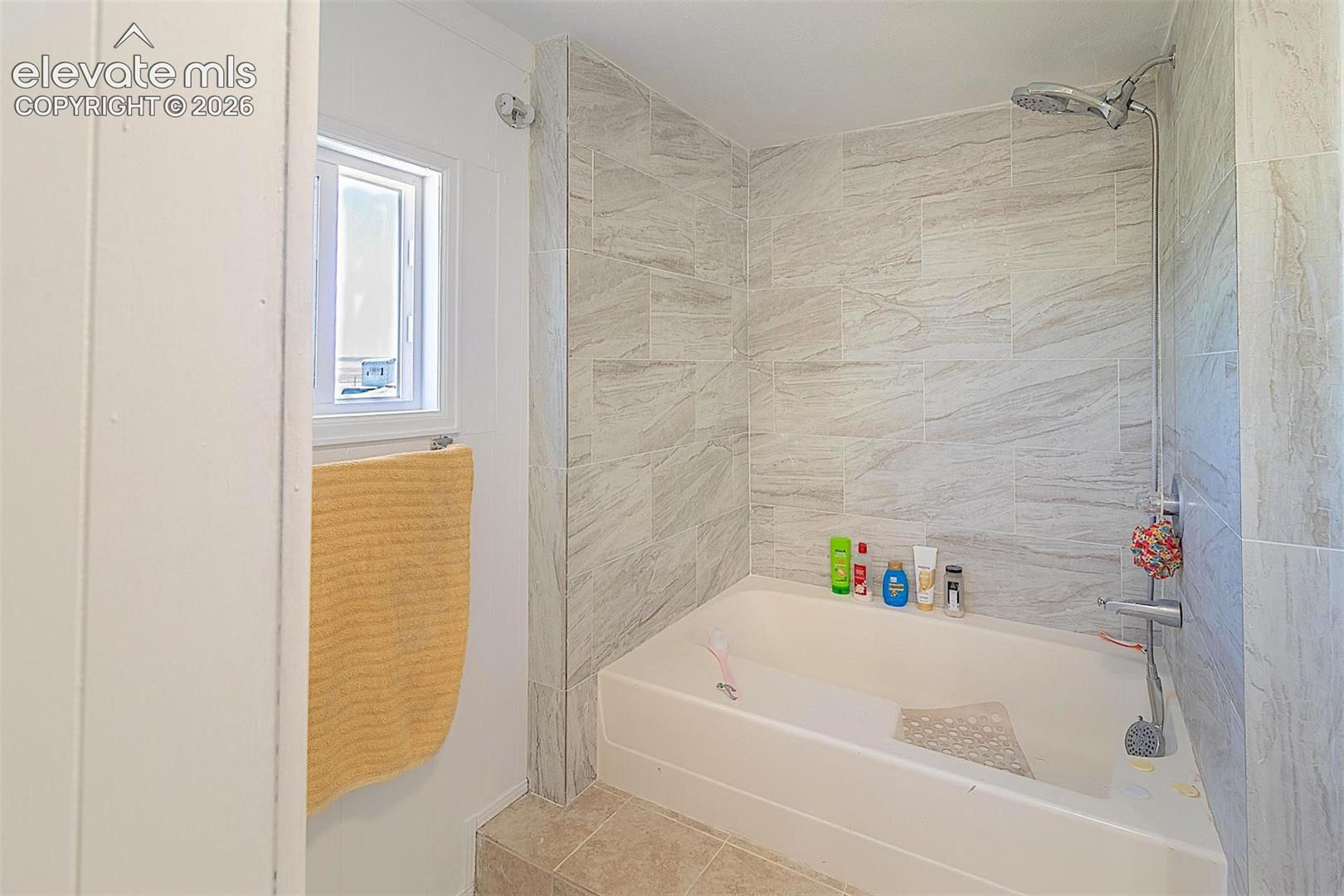 Full bathroom featuring shower / tub combination