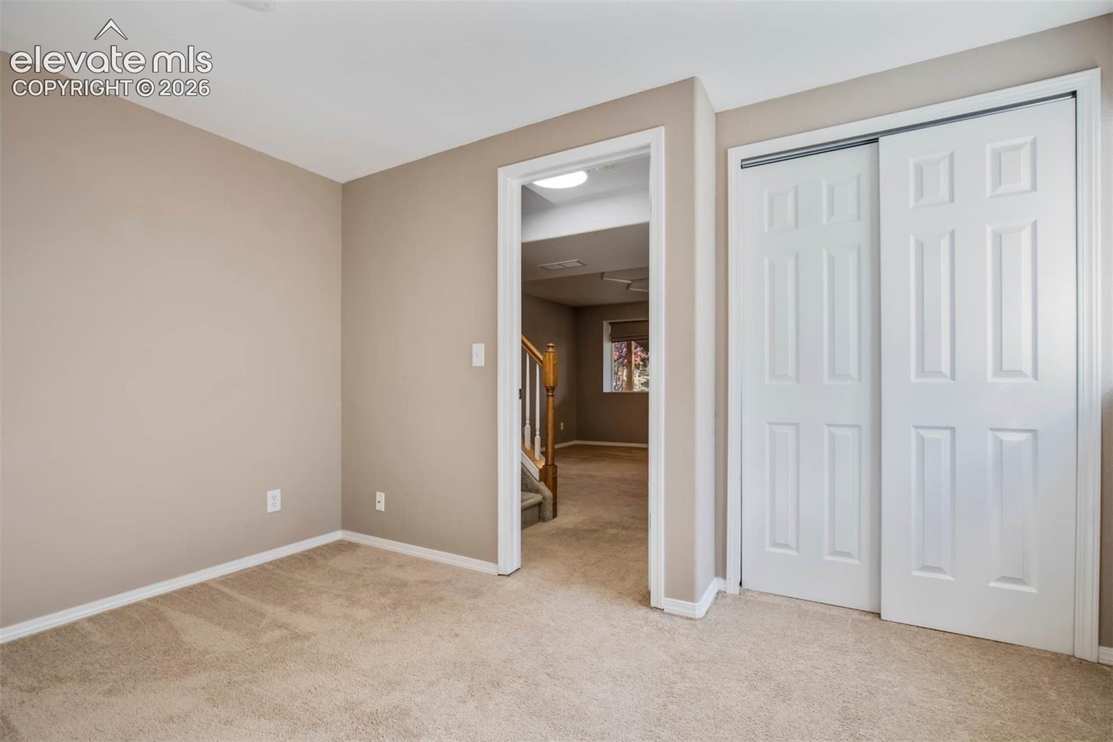 Additional spacious bedroom in basement perfect for guest accommodations or multi-generational living.